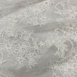 Ivory Fine Corded Lace — featuring scalloped edges, floral motifs and a corded texture, in nylon, 140cm wide