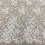 Ivory Corded Floral Lace — featuring scalloped edges, eyelash detail and floral motifs, 140cm wide