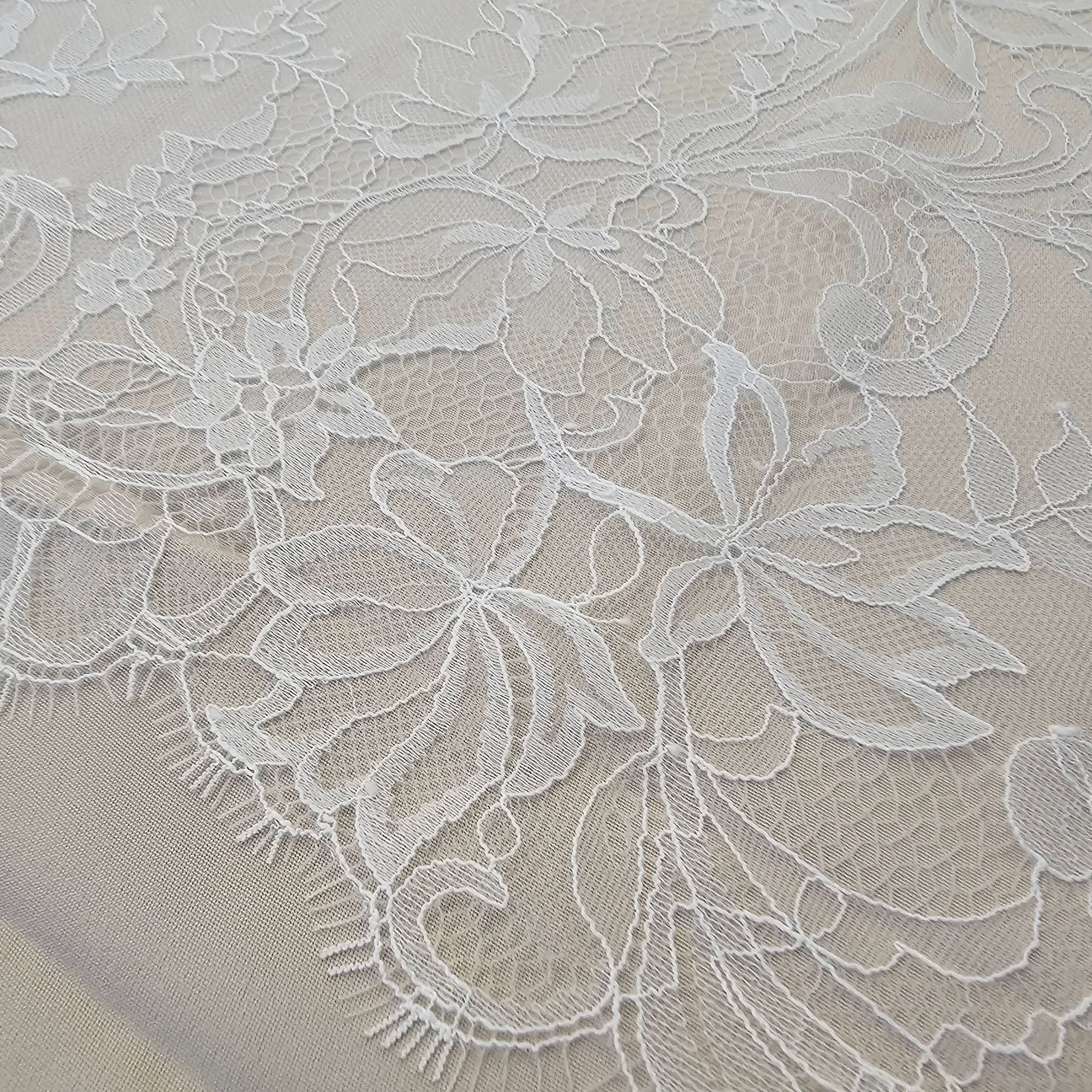 Ivory Fine Floral Lace — featuring scalloped edges, eyelash detail and floral motifs, in nylon, 130cm wide