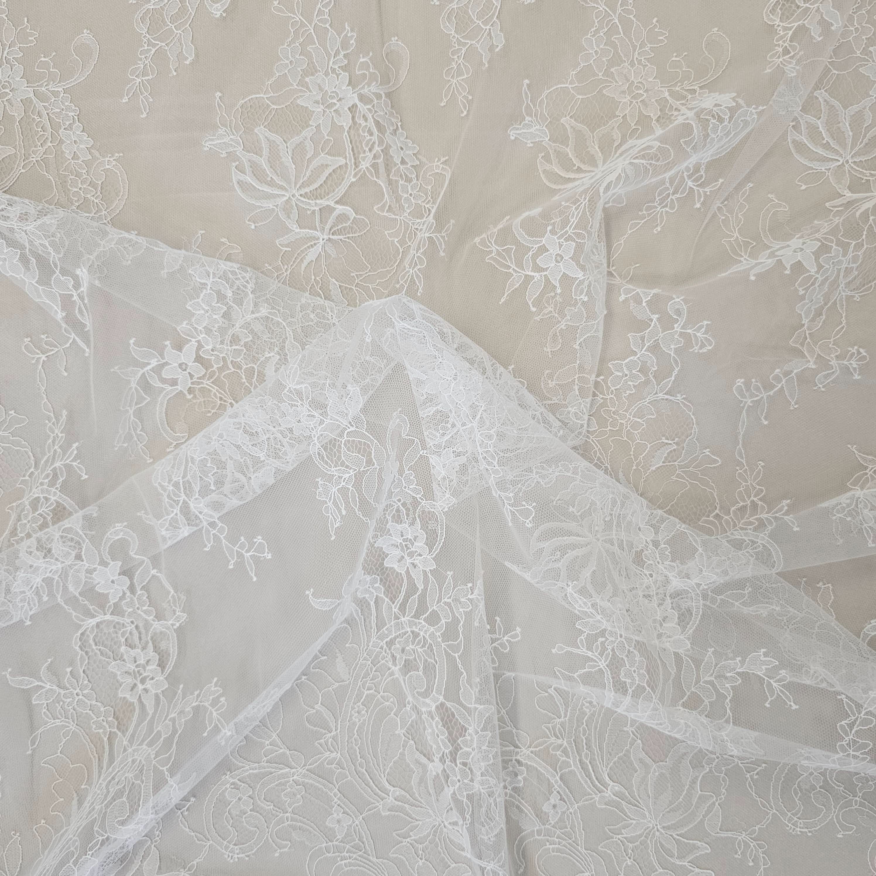 Ivory Fine Floral Lace — featuring scalloped edges, eyelash detail and floral motifs, in nylon, 130cm wide