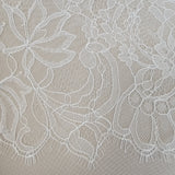 Ivory Fine lace trim — featuring scalloped edges, eyelash detail and floral motifs, in nylon and viscose, 27cm wide
