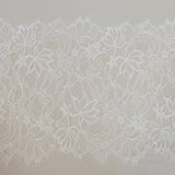 Ivory Fine lace trim — featuring scalloped edges, eyelash detail and floral motifs, in nylon and viscose, 27cm wide