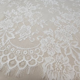 Ivory Fine Floral Lace — featuring scalloped edges and floral motifs, 130cm wide