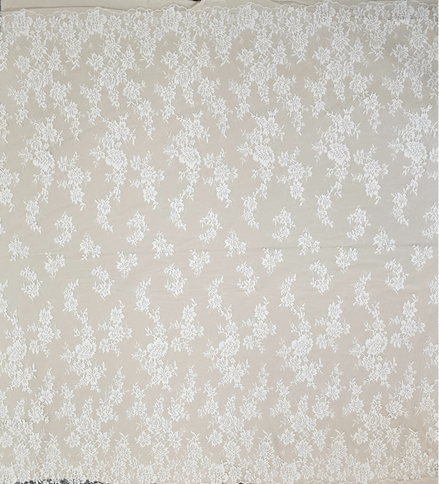Ivory Fine Floral Lace — featuring scalloped edges, eyelash detail and floral motifs, in nylon, 130cm wide
