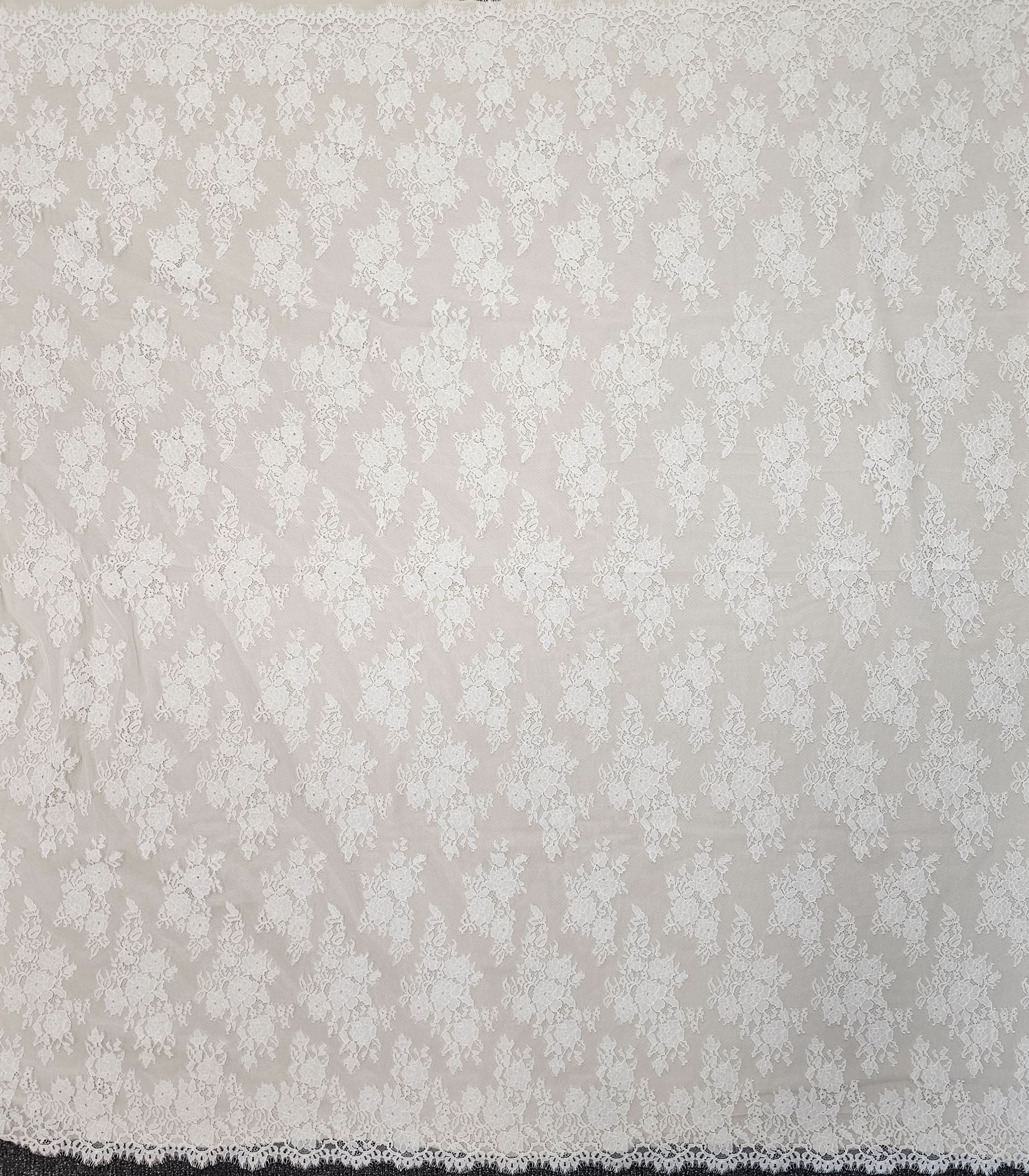 Ivory Fine Floral Lace — featuring scalloped edges, eyelash detail and floral motifs, in nylon and cotton, 150cm wide