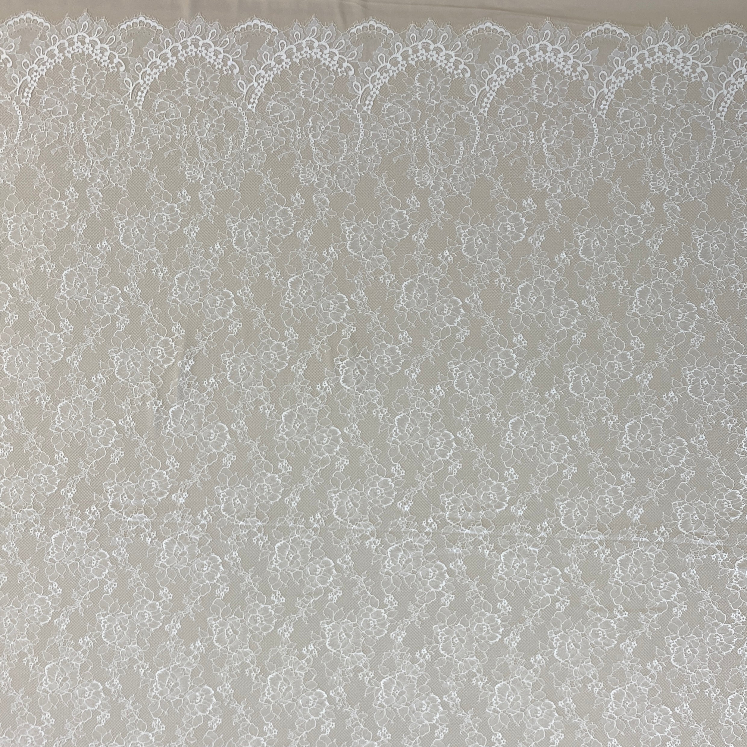 Ivory Floral Lace — featuring scalloped edges, eyelash detail and floral motifs, in nylon, 150cm wide
