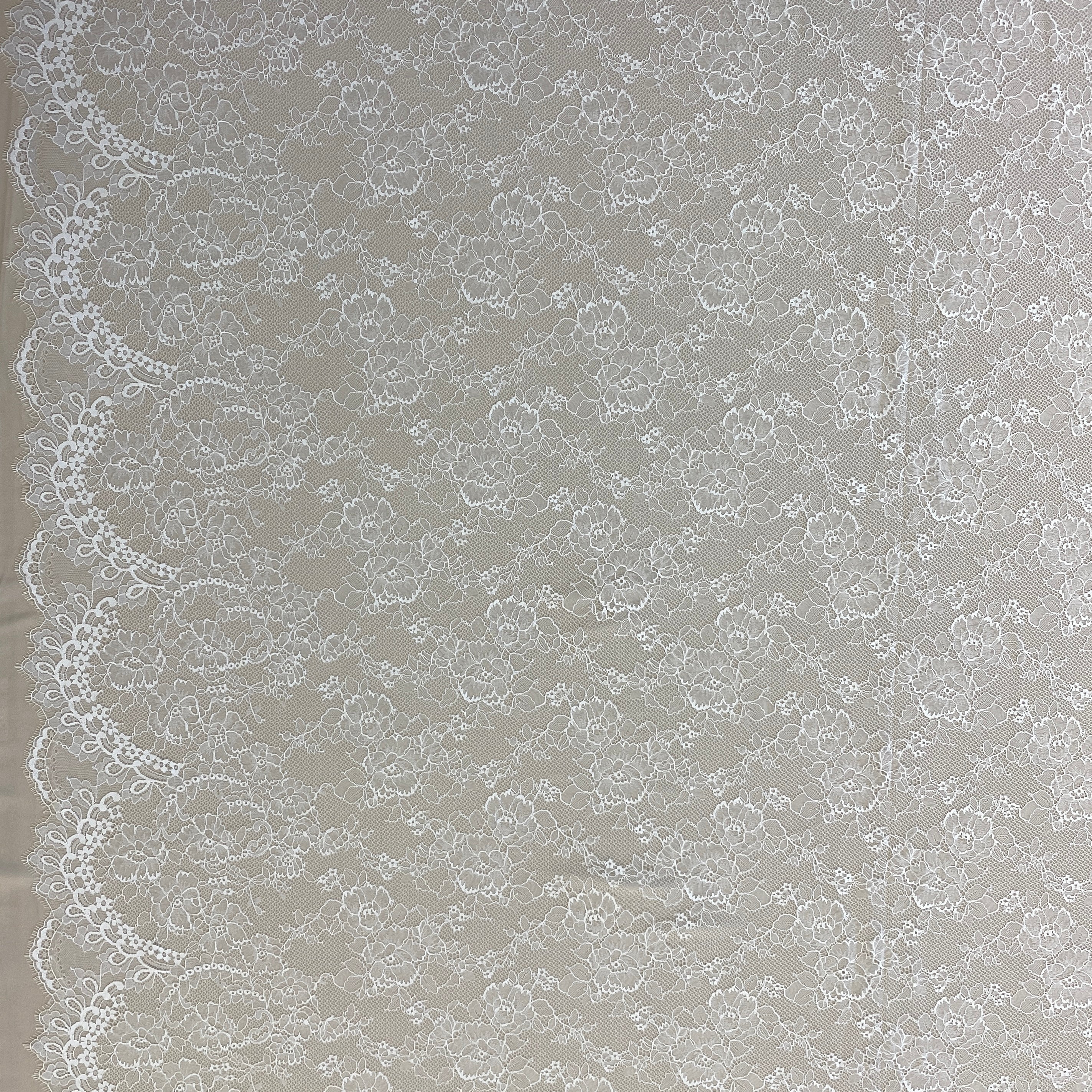 Ivory Floral Lace — featuring scalloped edges, eyelash detail and floral motifs, in nylon, 150cm wide
