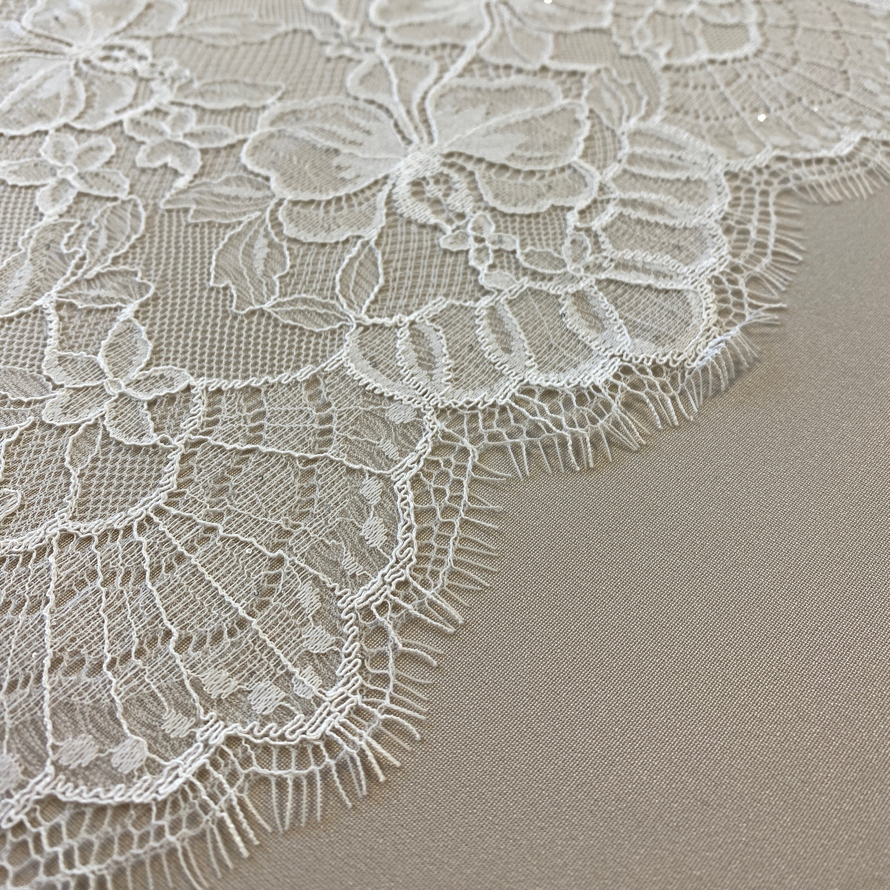 Ivory Glitter Floral Lace — featuring scalloped edges and floral motifs, in nylon, 140cm wide