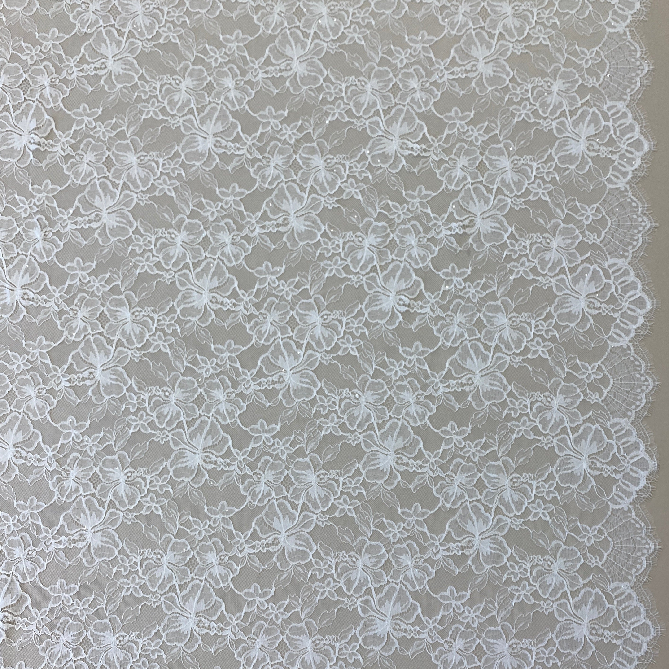 Ivory Glitter Floral Lace — featuring scalloped edges and floral motifs, in nylon, 140cm wide
