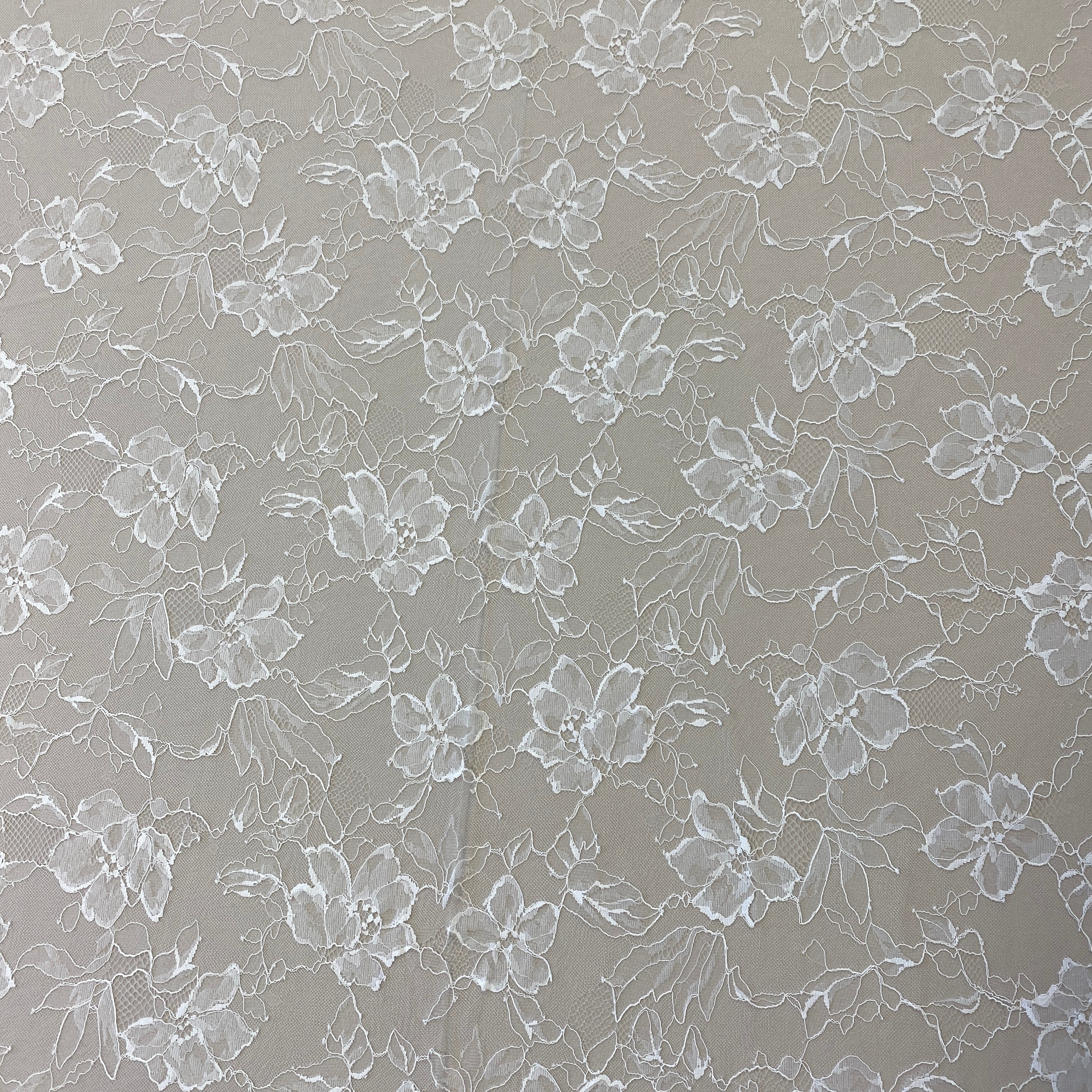 Ivory Floral Lace — featuring scalloped edges, eyelash detail and floral motifs, in nylon, 140cm wide