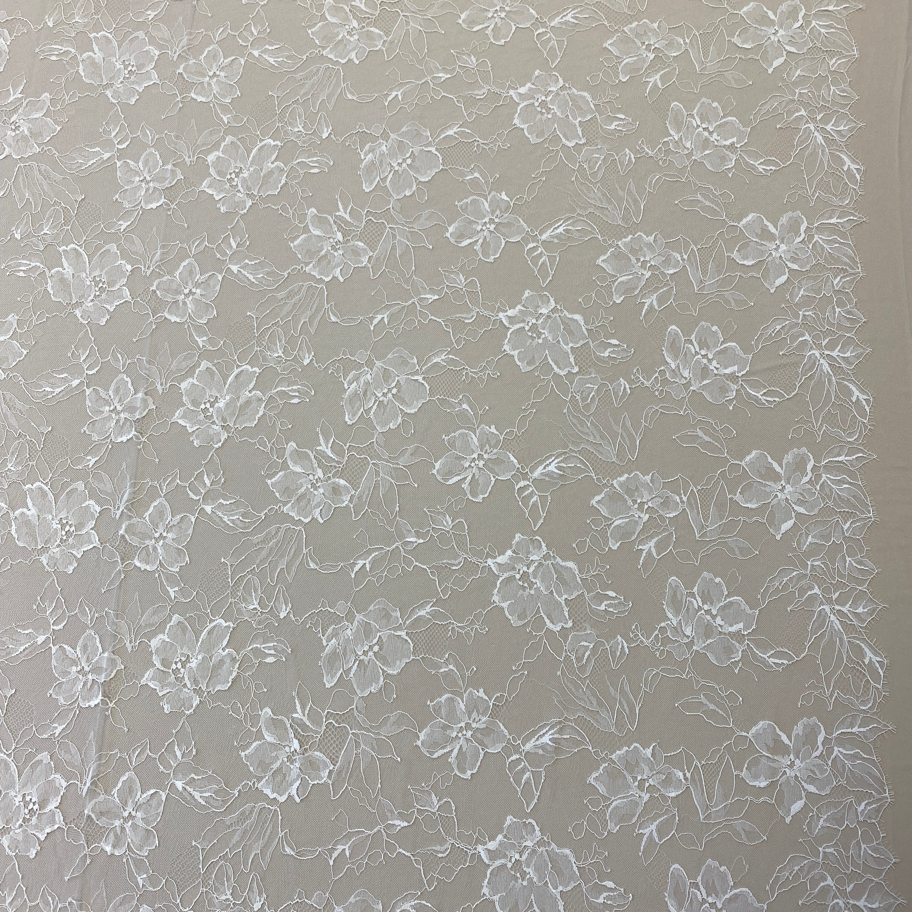 Ivory Floral Lace — featuring scalloped edges, eyelash detail and floral motifs, in nylon, 140cm wide