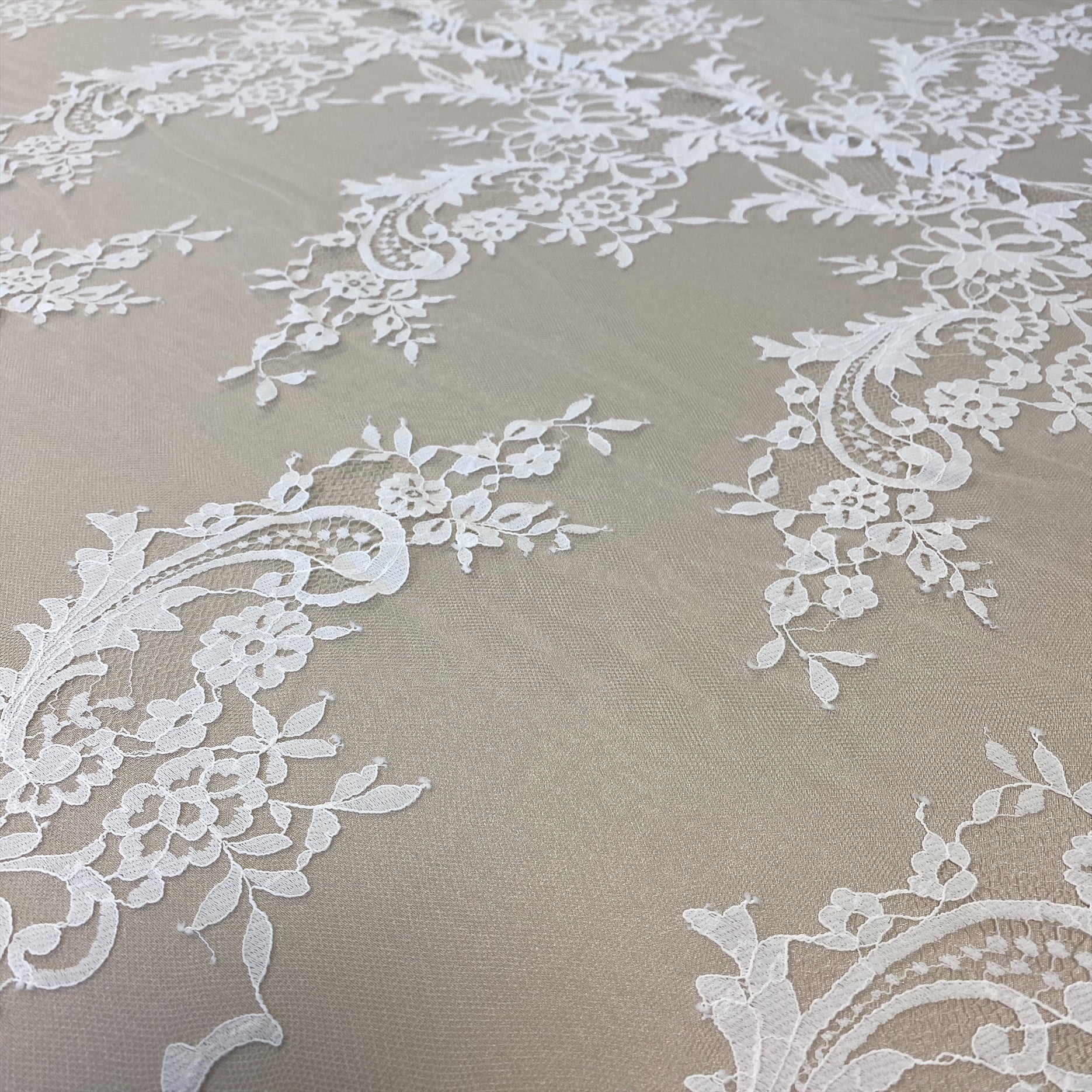 Ivory Floral Lace — featuring scalloped edges, eyelash detail and floral motifs, in nylon, 150cm wide