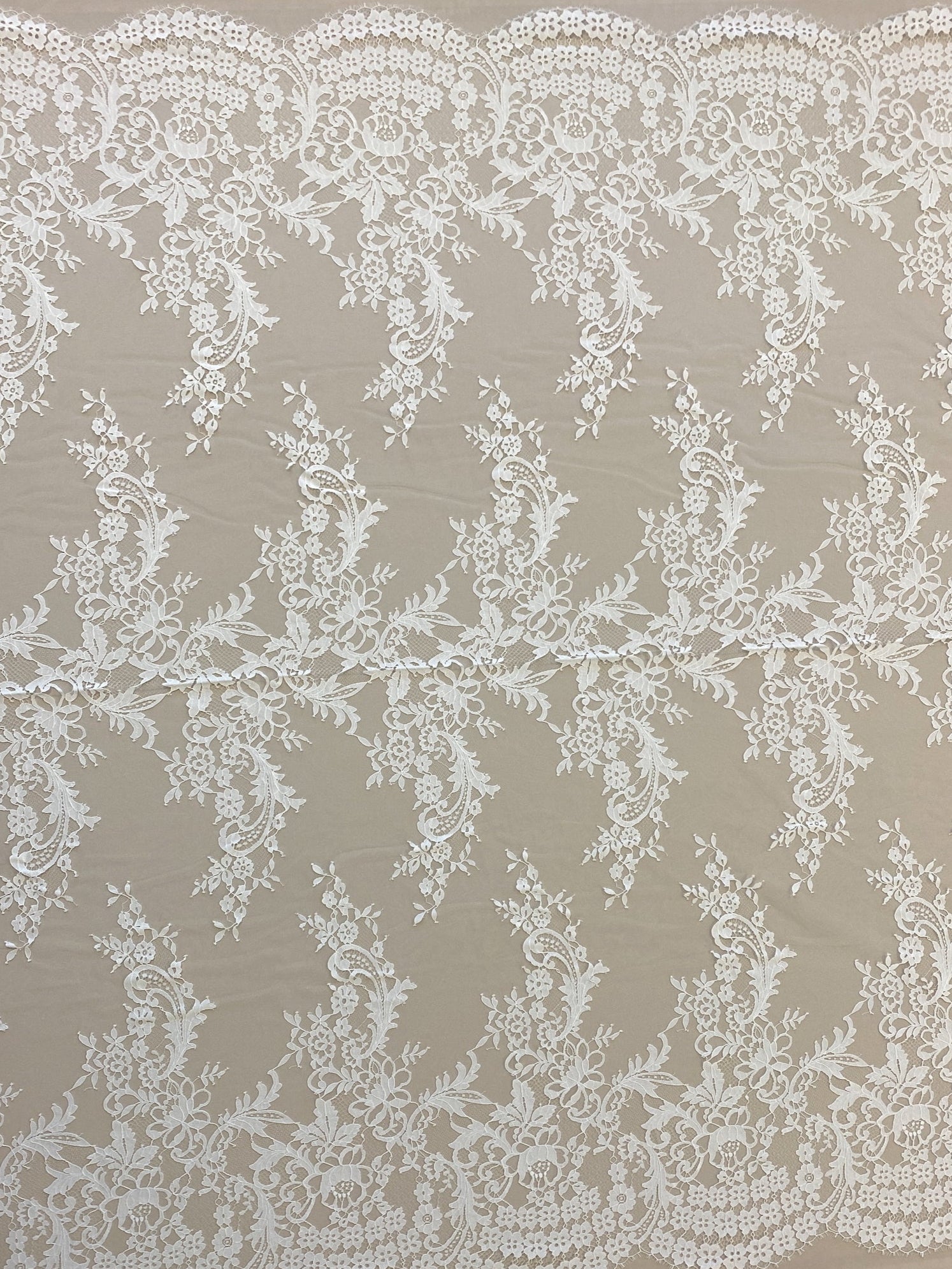 Ivory Floral Lace — featuring scalloped edges, eyelash detail and floral motifs, in nylon, 150cm wide
