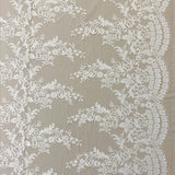 Ivory Floral Lace — featuring scalloped edges, eyelash detail and floral motifs, in nylon, 150cm wide