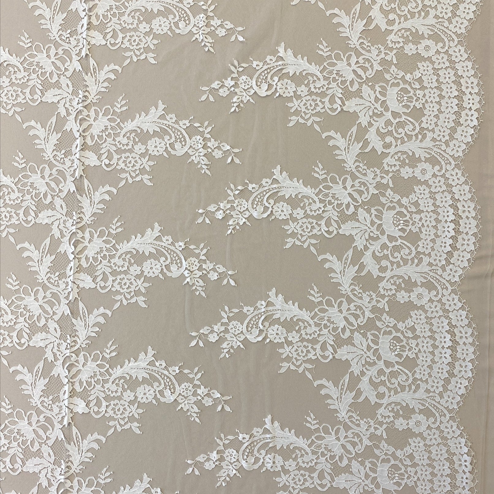 Ivory Floral Lace — featuring scalloped edges, eyelash detail and floral motifs, in nylon, 150cm wide