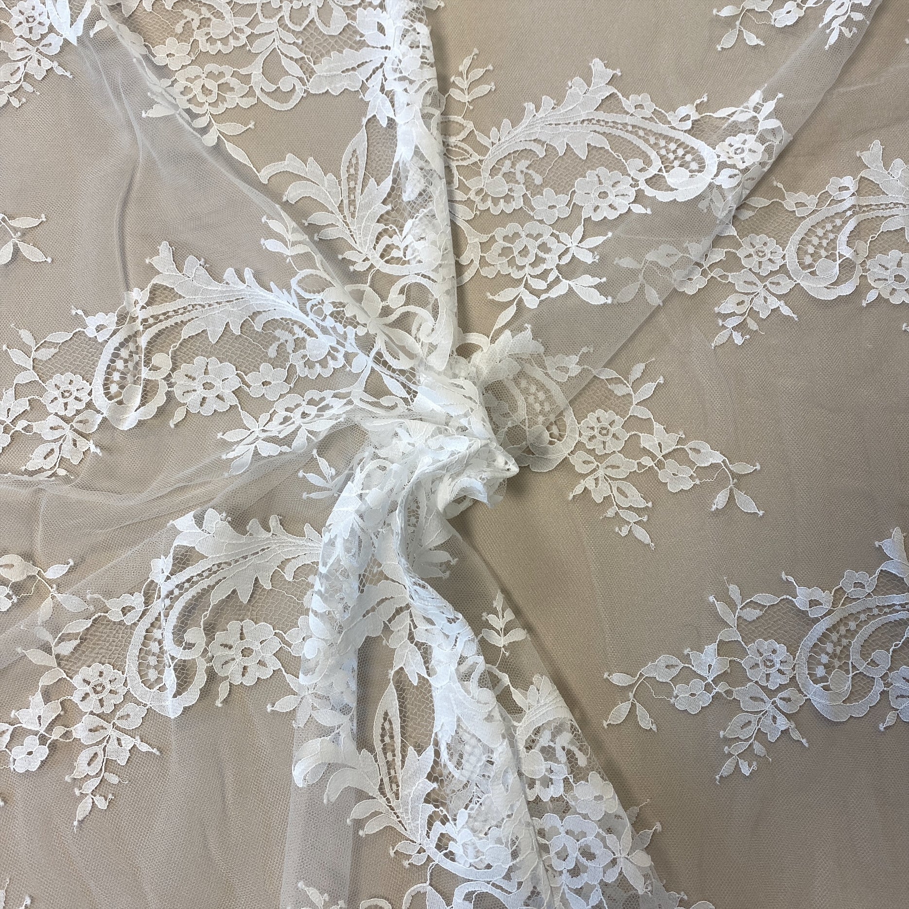 Ivory Floral Lace — featuring scalloped edges, eyelash detail and floral motifs, in nylon, 150cm wide