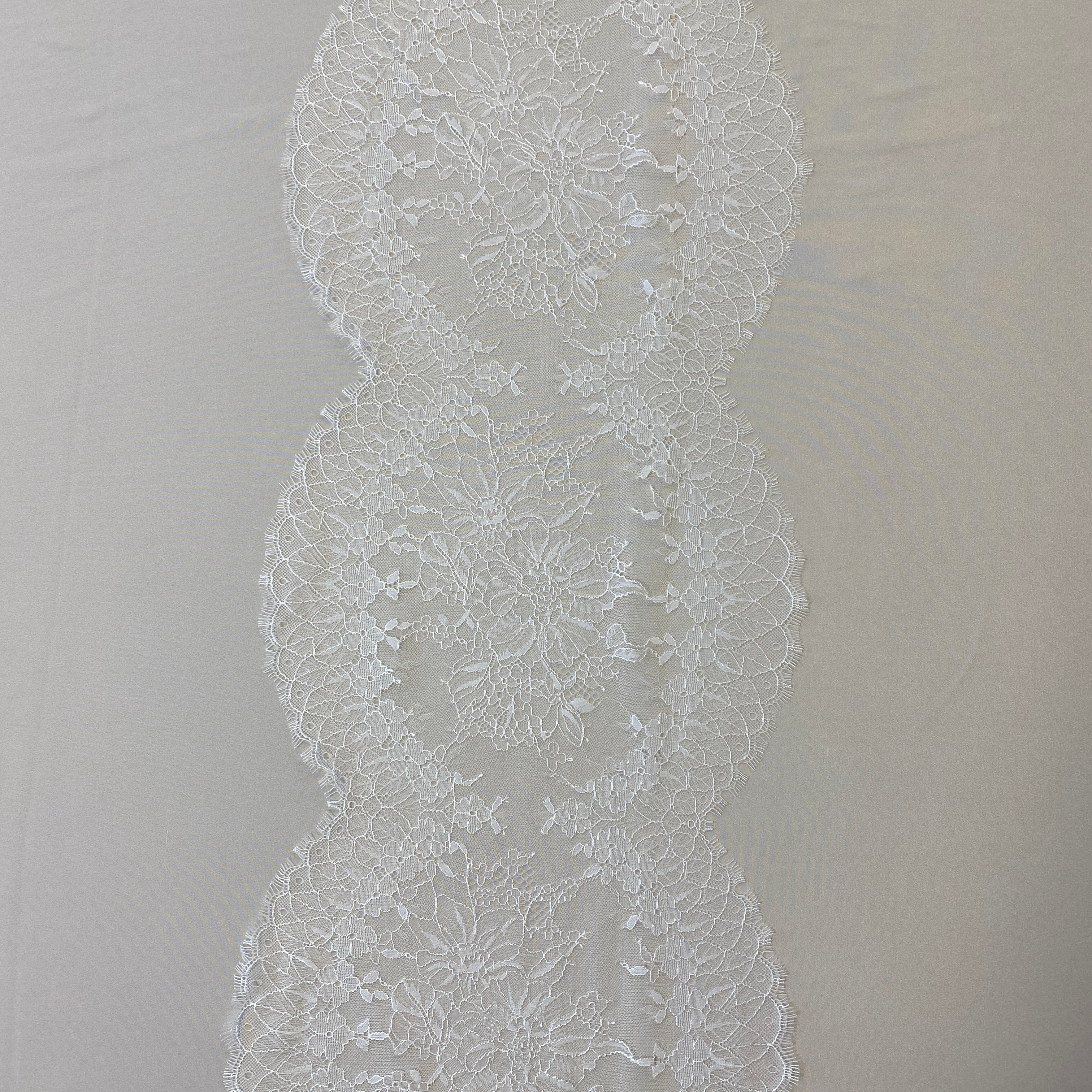 Ivory Fine lace trim — featuring scalloped edges, eyelash detail and floral motifs, 30cm wide