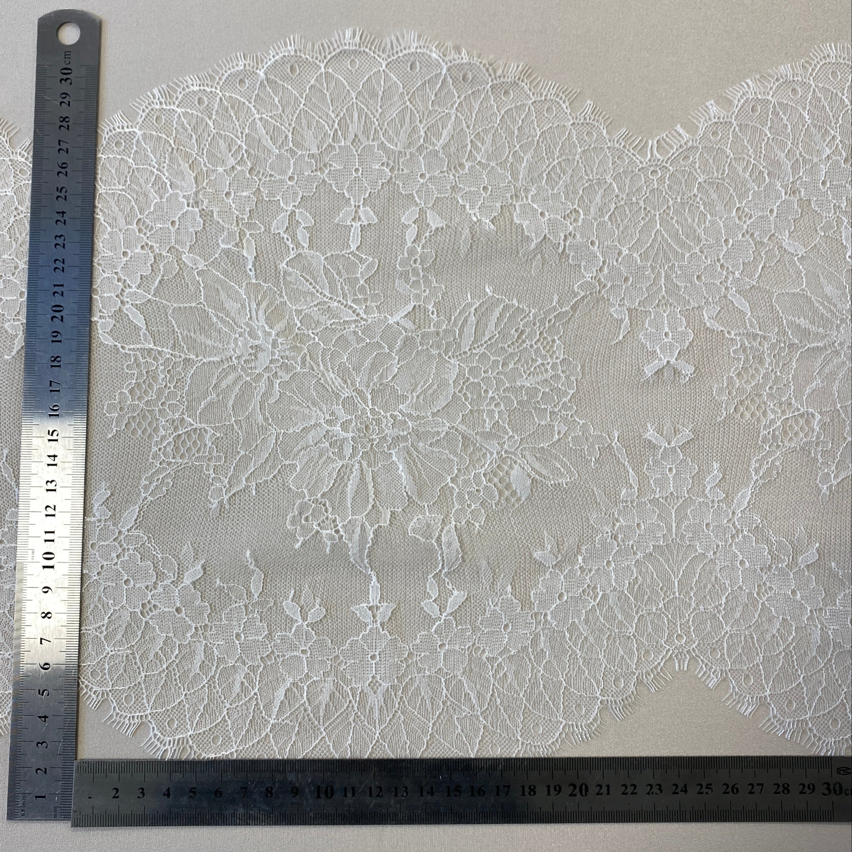 Ivory Fine lace trim — featuring scalloped edges, eyelash detail and floral motifs, 30cm wide