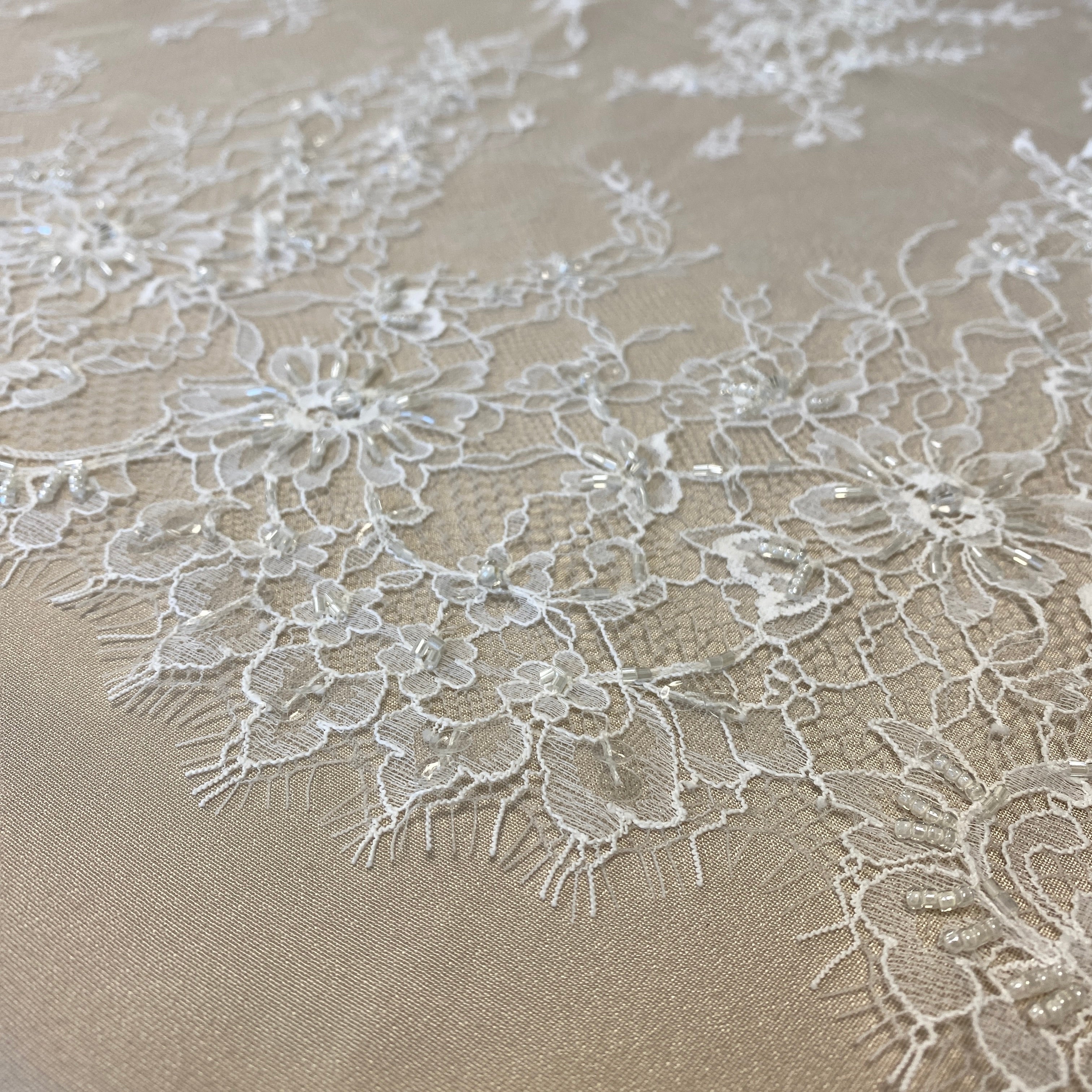 Ivory Beaded Fine Lace — featuring scalloped edges, eyelash detail and floral motifs, in nylon, 150cm wide