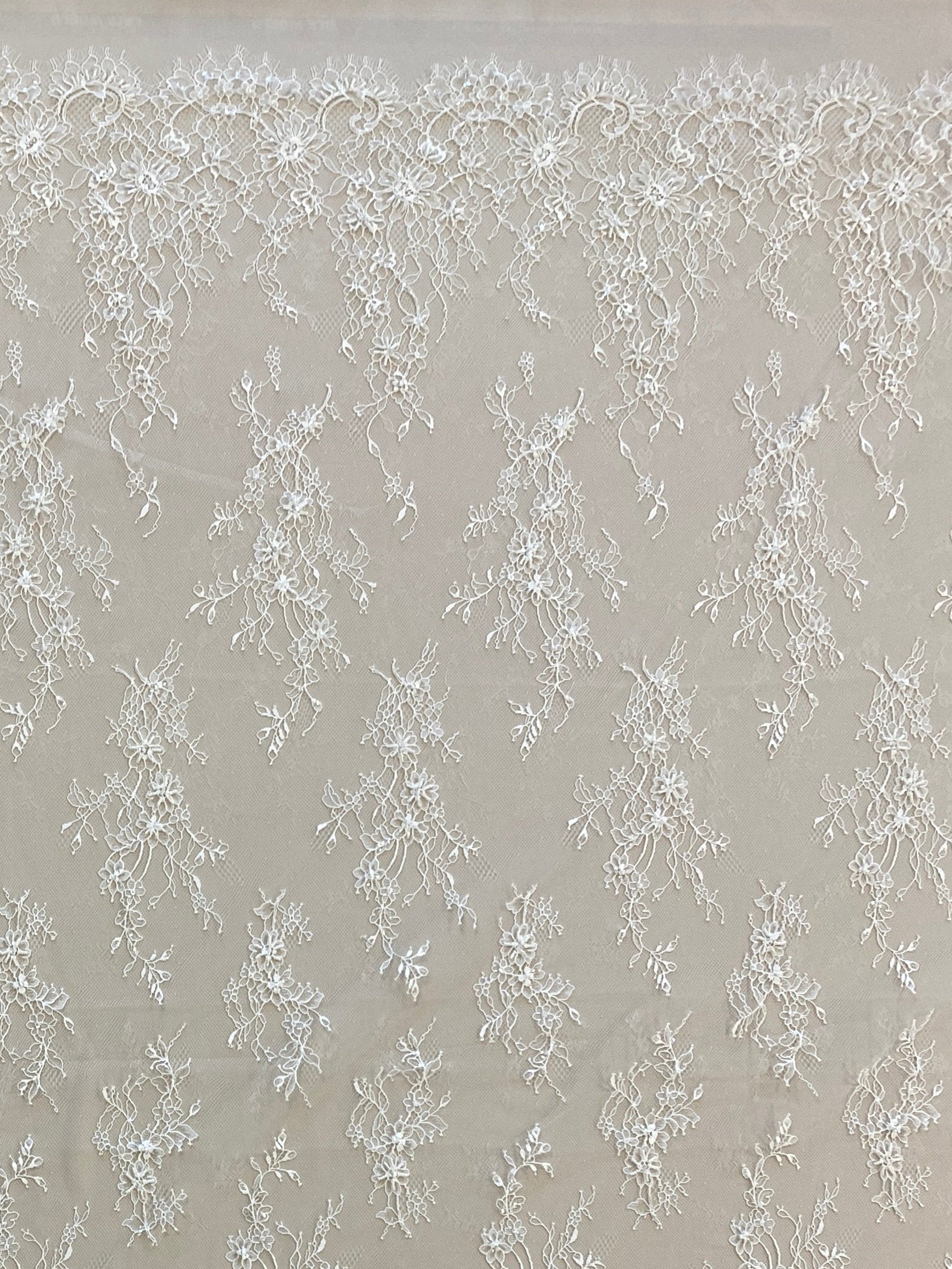 Ivory Beaded Fine Lace — featuring scalloped edges, eyelash detail and floral motifs, in nylon, 150cm wide