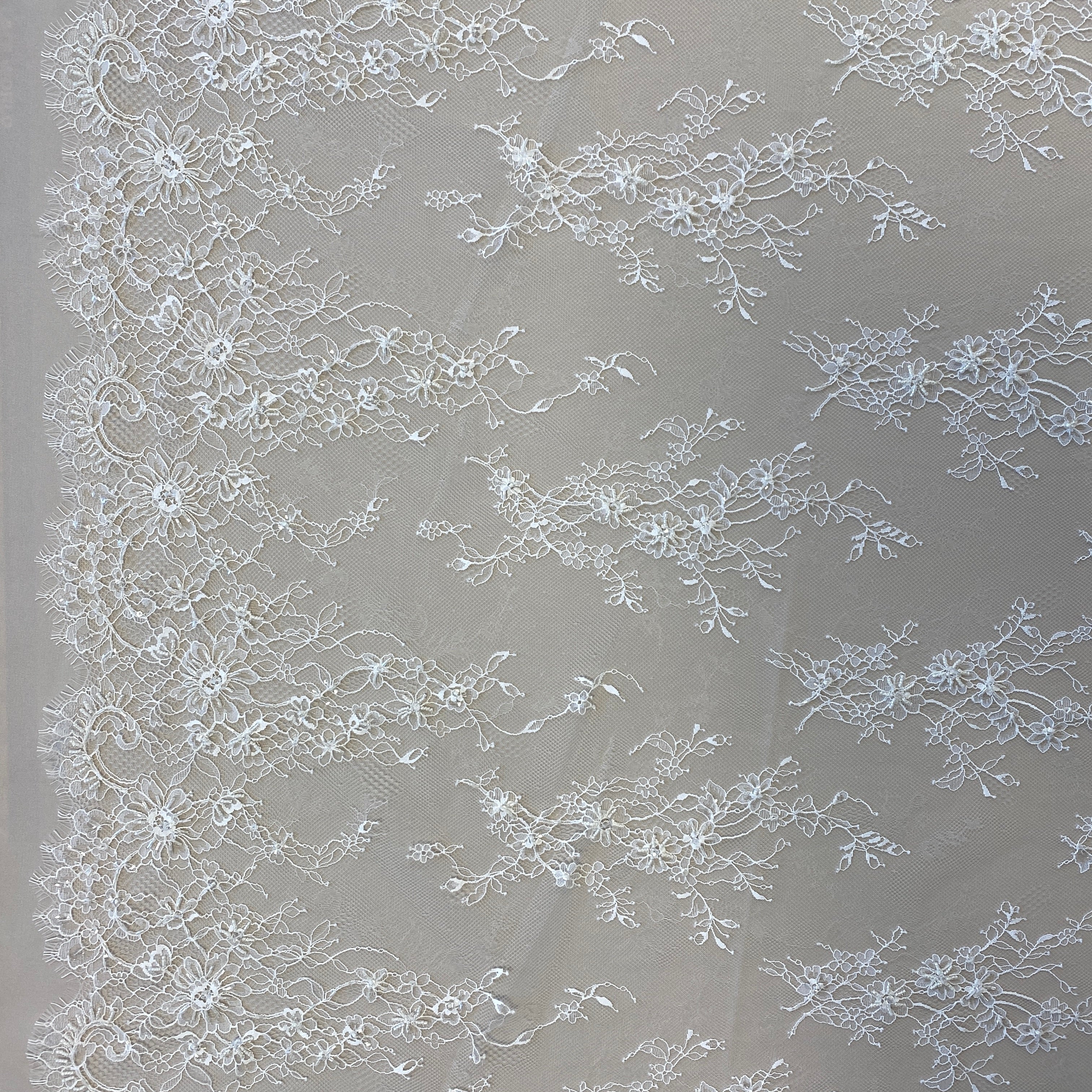 Ivory Beaded Fine Lace — featuring scalloped edges, eyelash detail and floral motifs, in nylon, 150cm wide