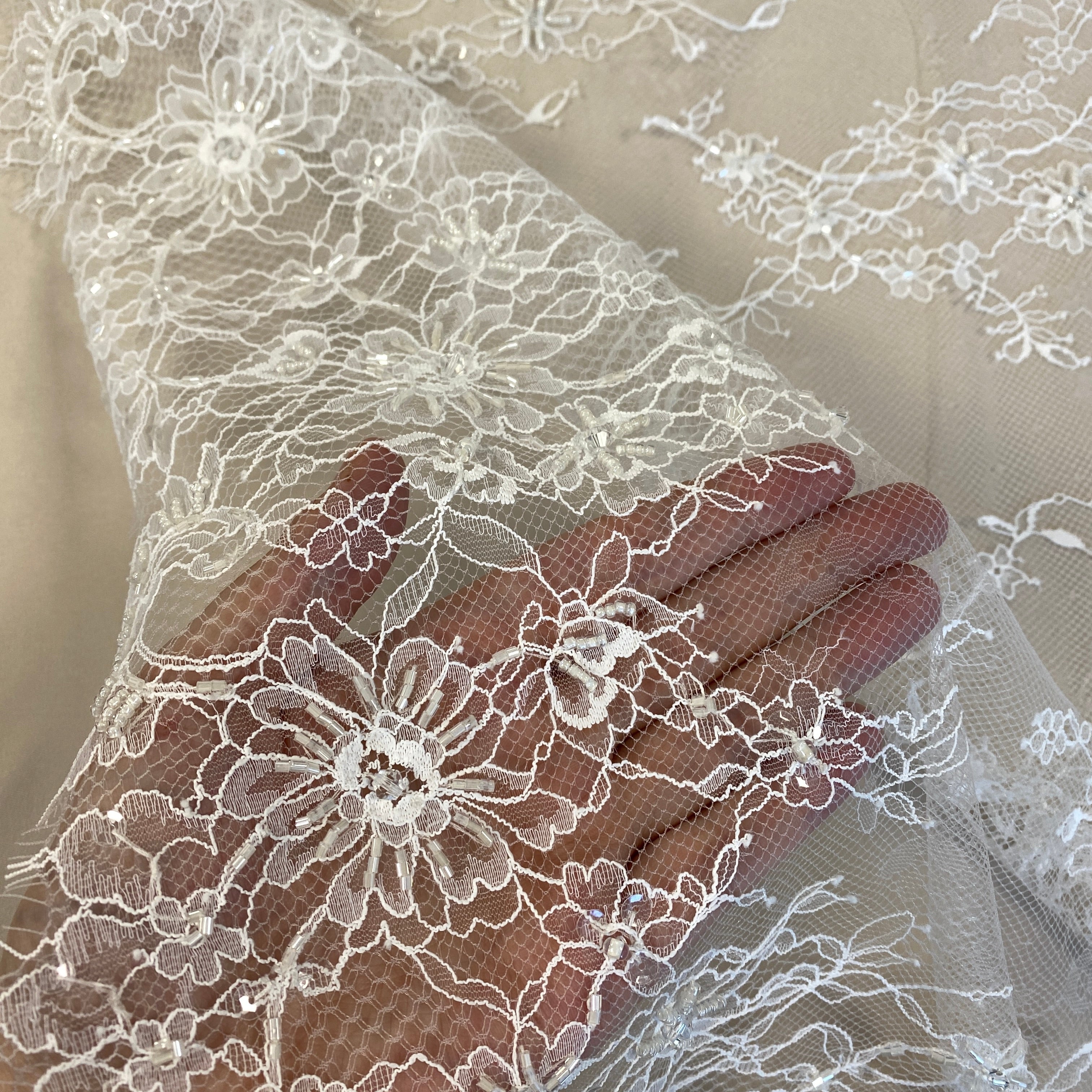 Ivory Beaded Fine Lace — featuring scalloped edges, eyelash detail and floral motifs, in nylon, 150cm wide
