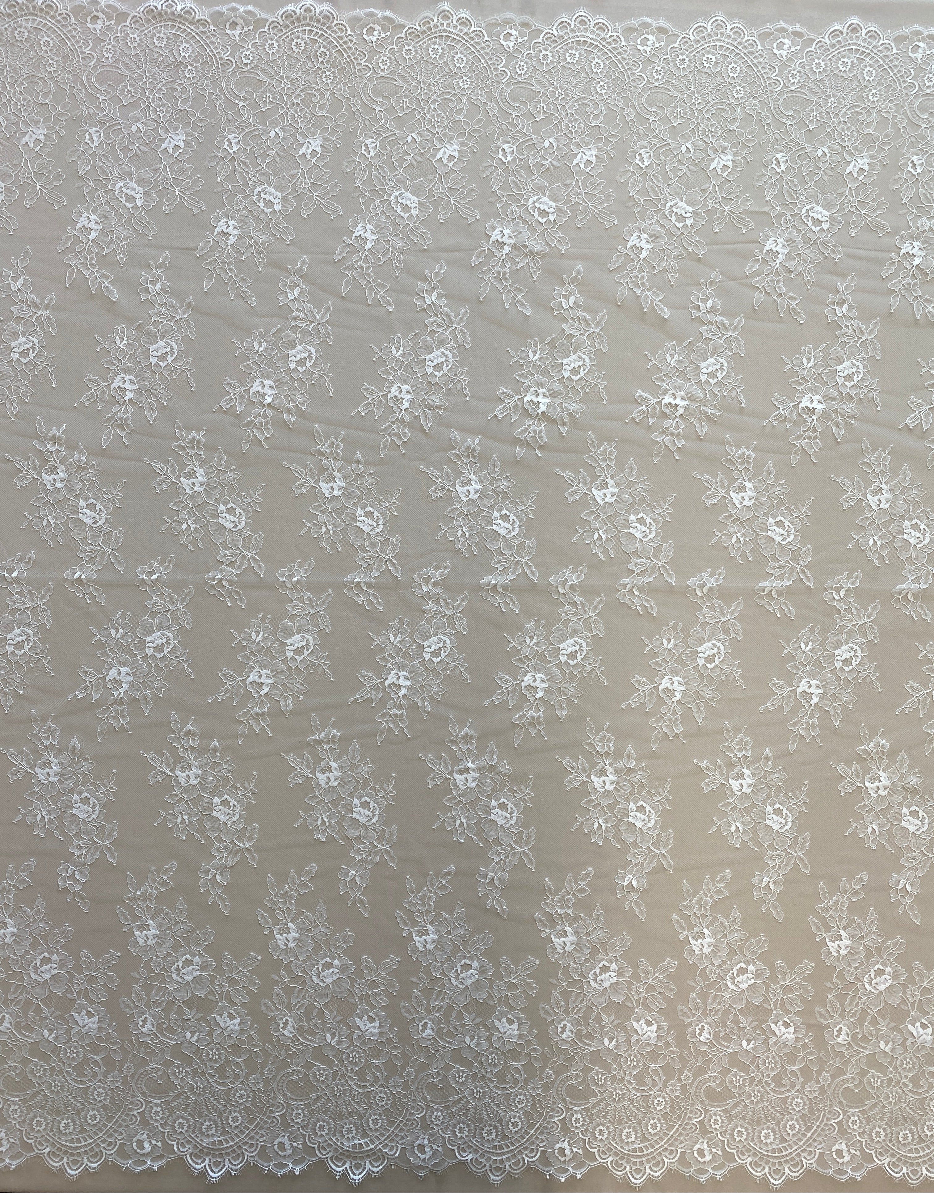 Ivory Fine Lace — featuring scalloped edges and floral motifs, 140cm wide