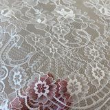 Ivory Fine Lace — featuring scalloped edges and floral motifs, 140cm wide