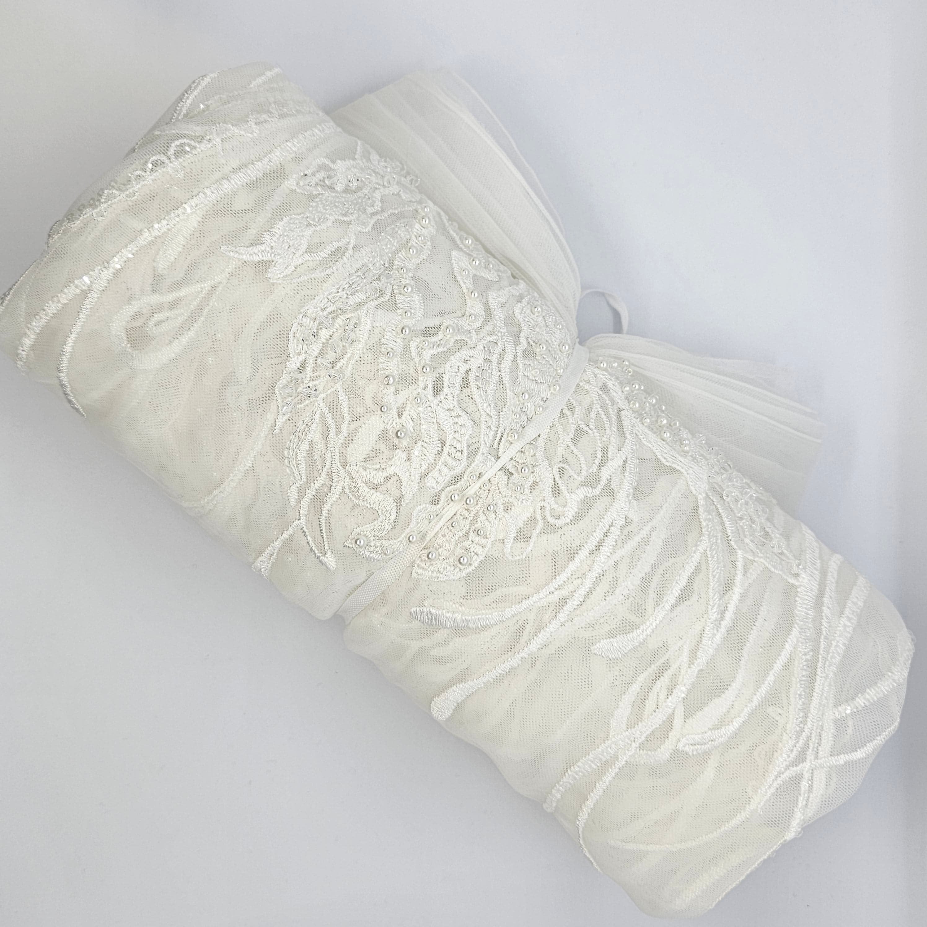 Ivory Embroidered Floral Tulle — featuring floral motifs and hand-beading, 50% nylon 50% rayon, 130cm wide