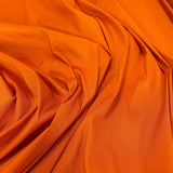Burnt Orange Polyester Dupion — mid-weight and crisp with a lightly slubbed texture, 100% polyester, 140cm wide