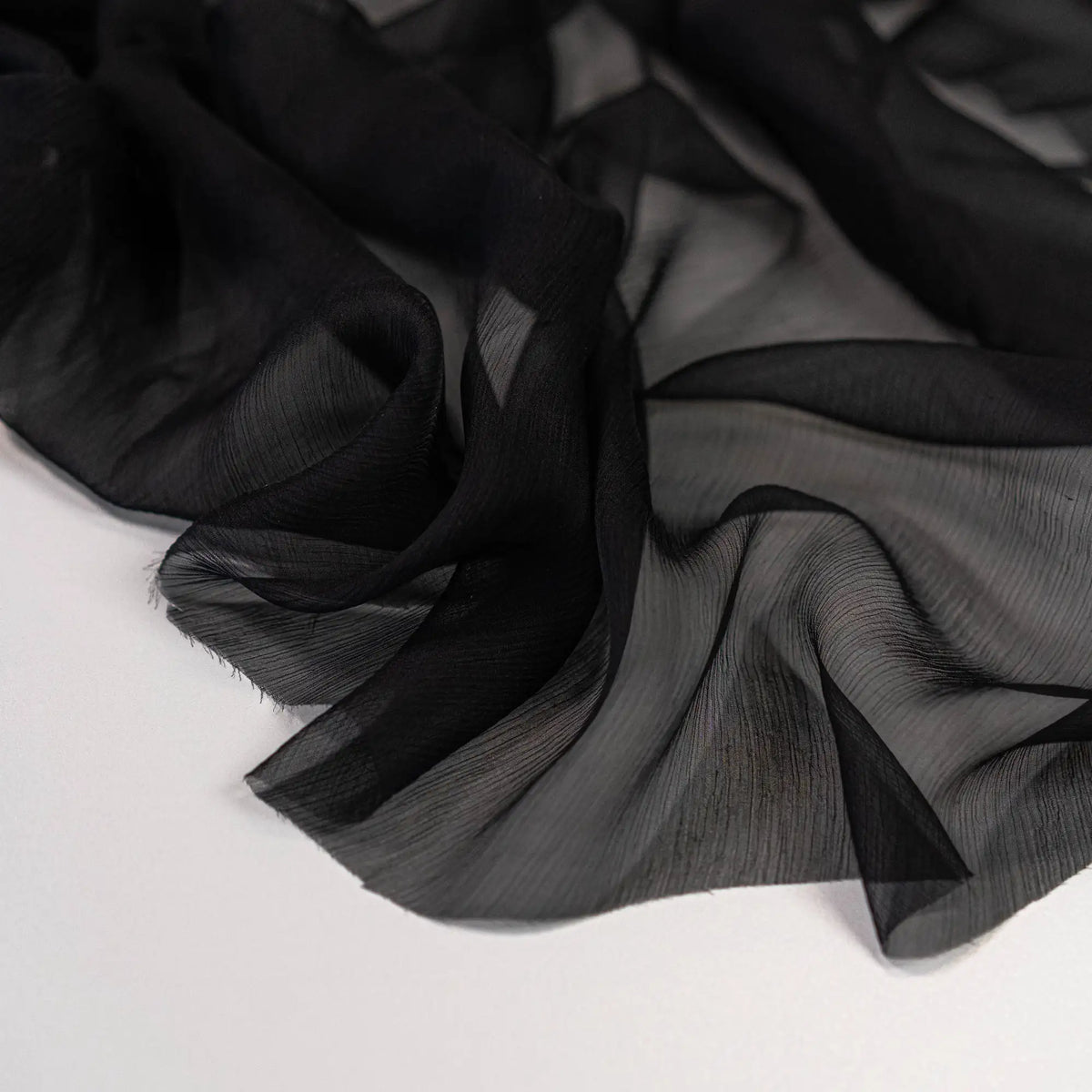 Black Crinkle Chiffon — a lightweight, sheer silk chiffon with a crinkled texture, 100% silk, 137cm wide