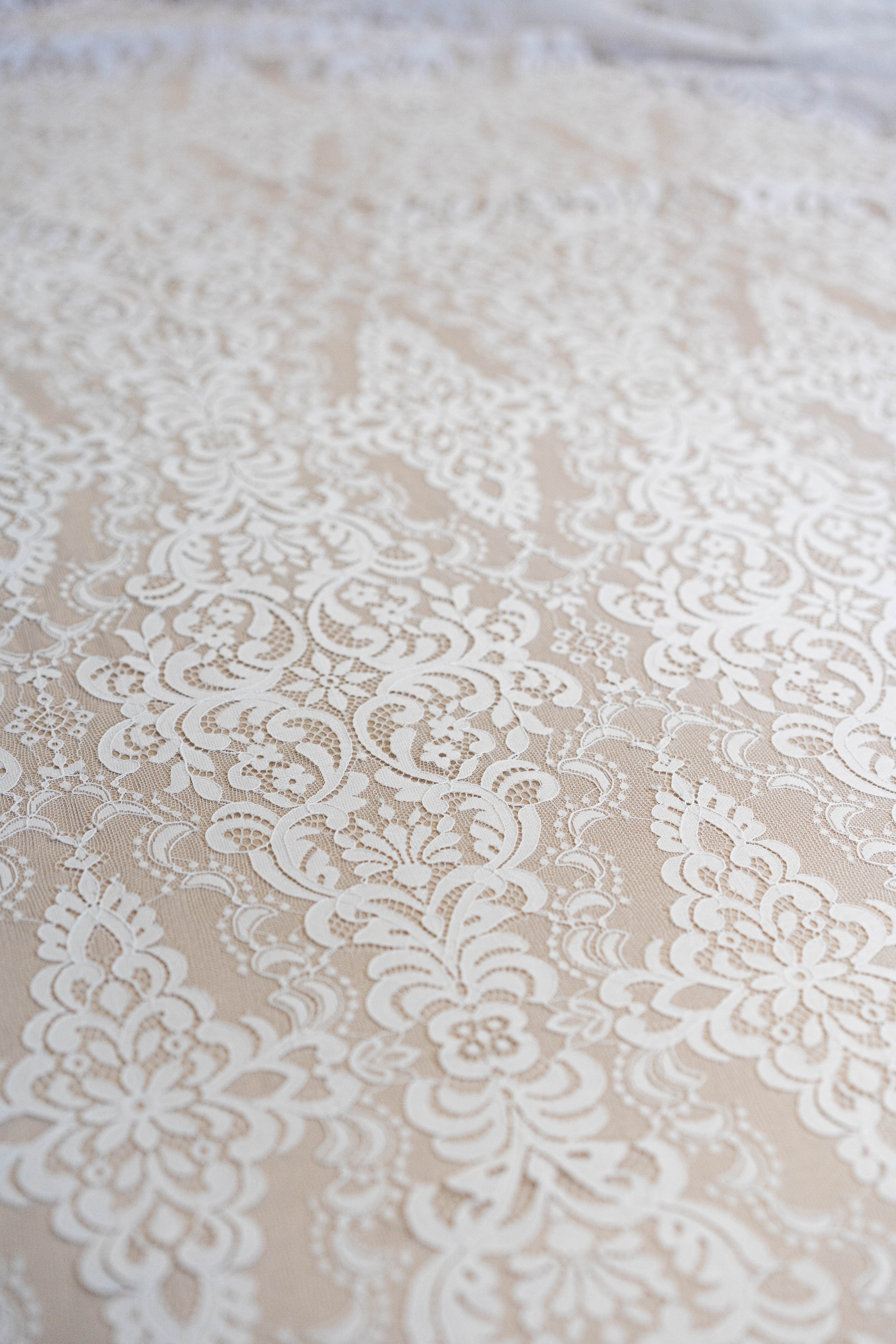 Light Ivory Corded Fine Lace — featuring scalloped edges, eyelash detail, arabesque motifs and a corded texture, 130cm wide