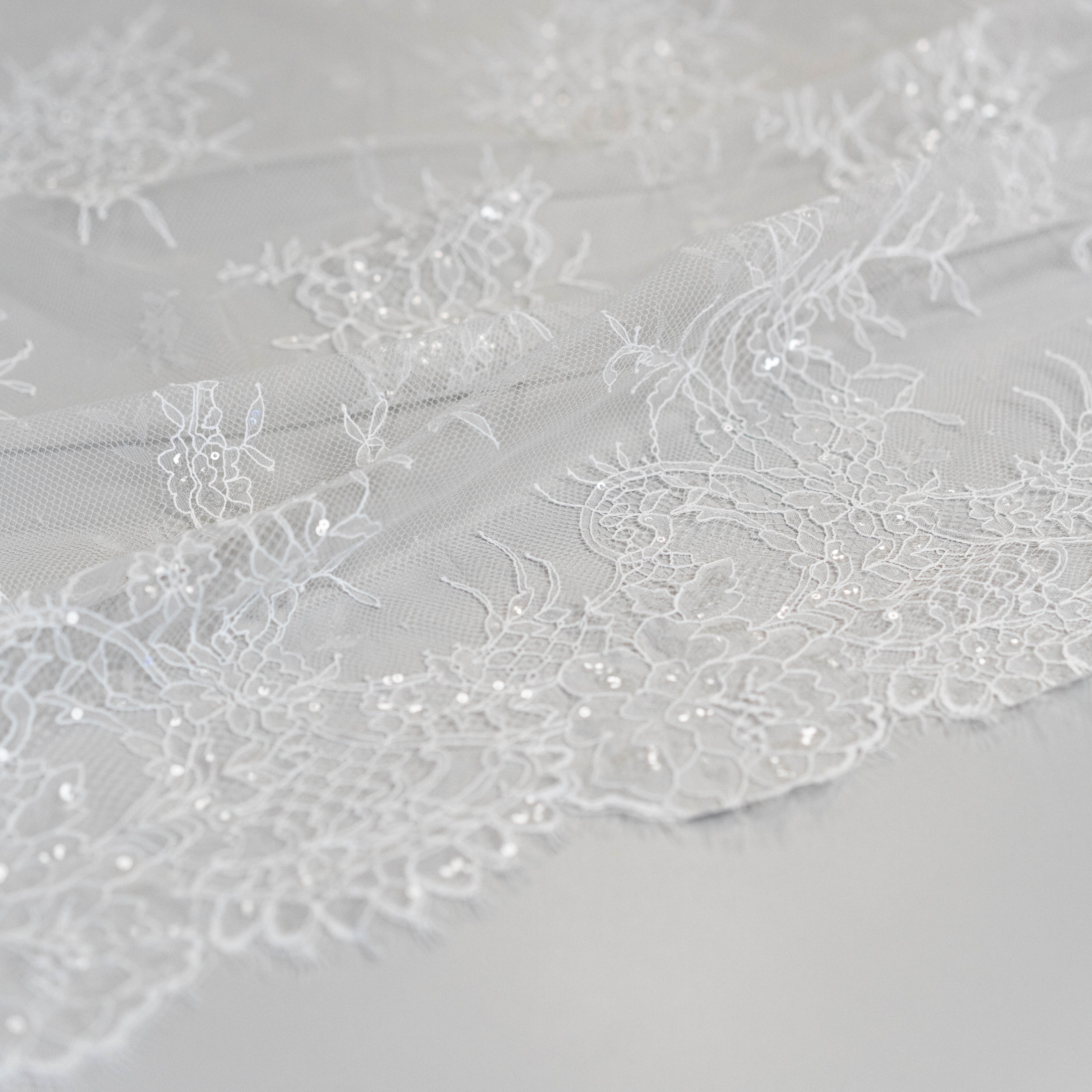 Ivory Beaded Lace — featuring scalloped edges, floral motifs and hand-beading, in nylon and viscose, 130cm wide