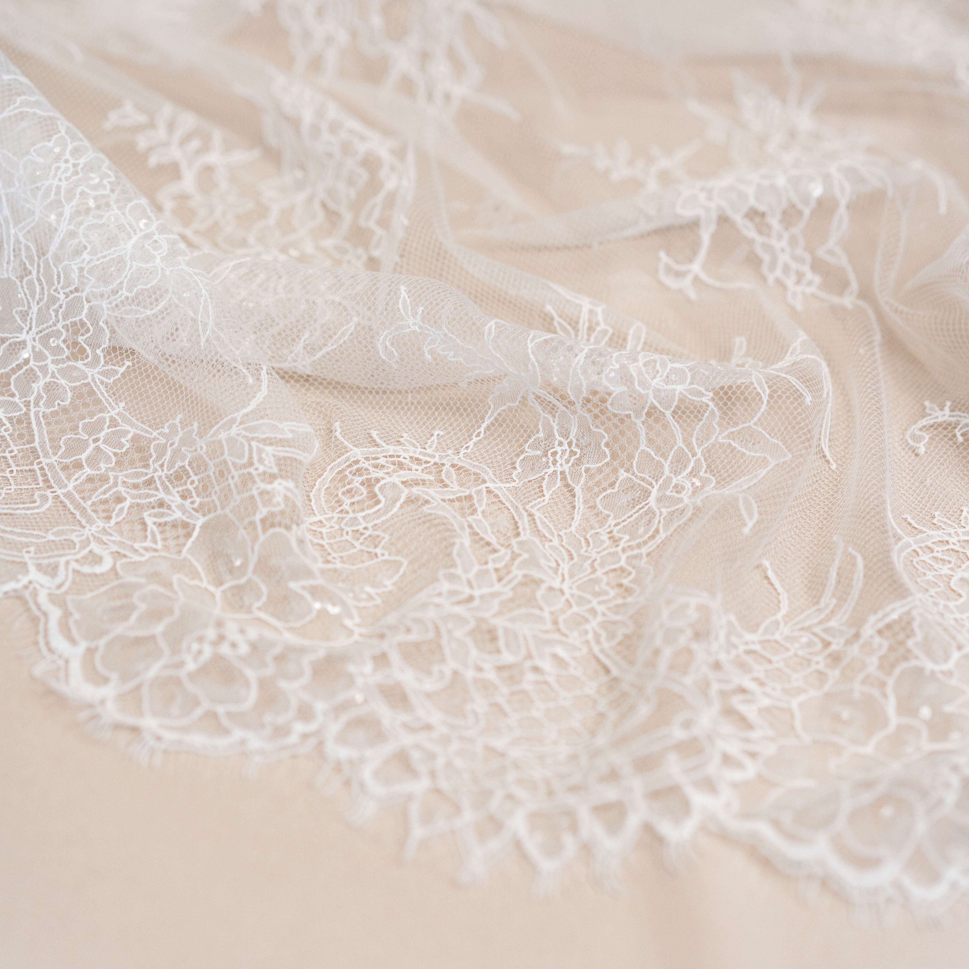 Ivory Beaded Lace — featuring scalloped edges, floral motifs and hand-beading, in nylon and viscose, 130cm wide