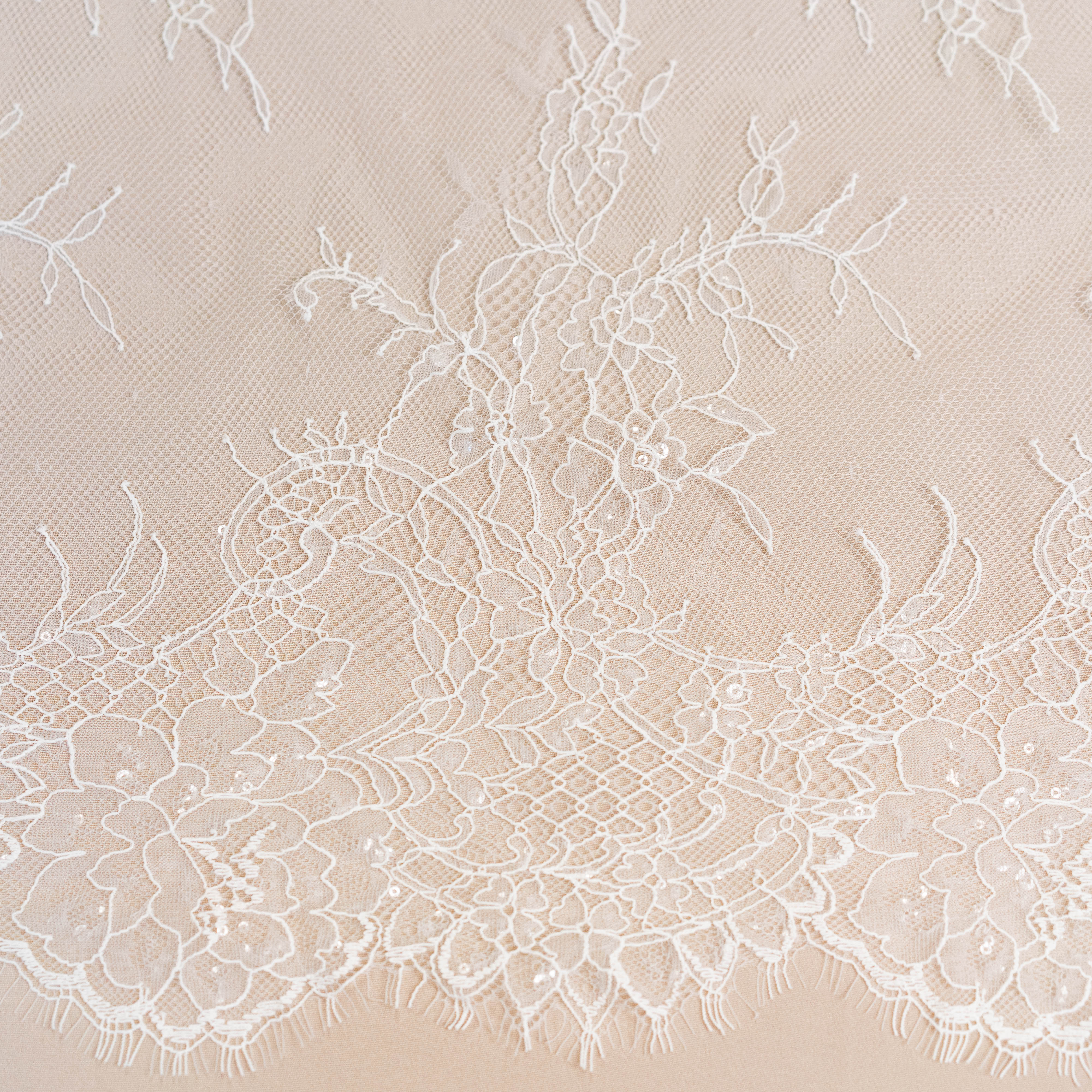 Ivory Beaded Lace — featuring scalloped edges, floral motifs and hand-beading, in nylon and viscose, 130cm wide