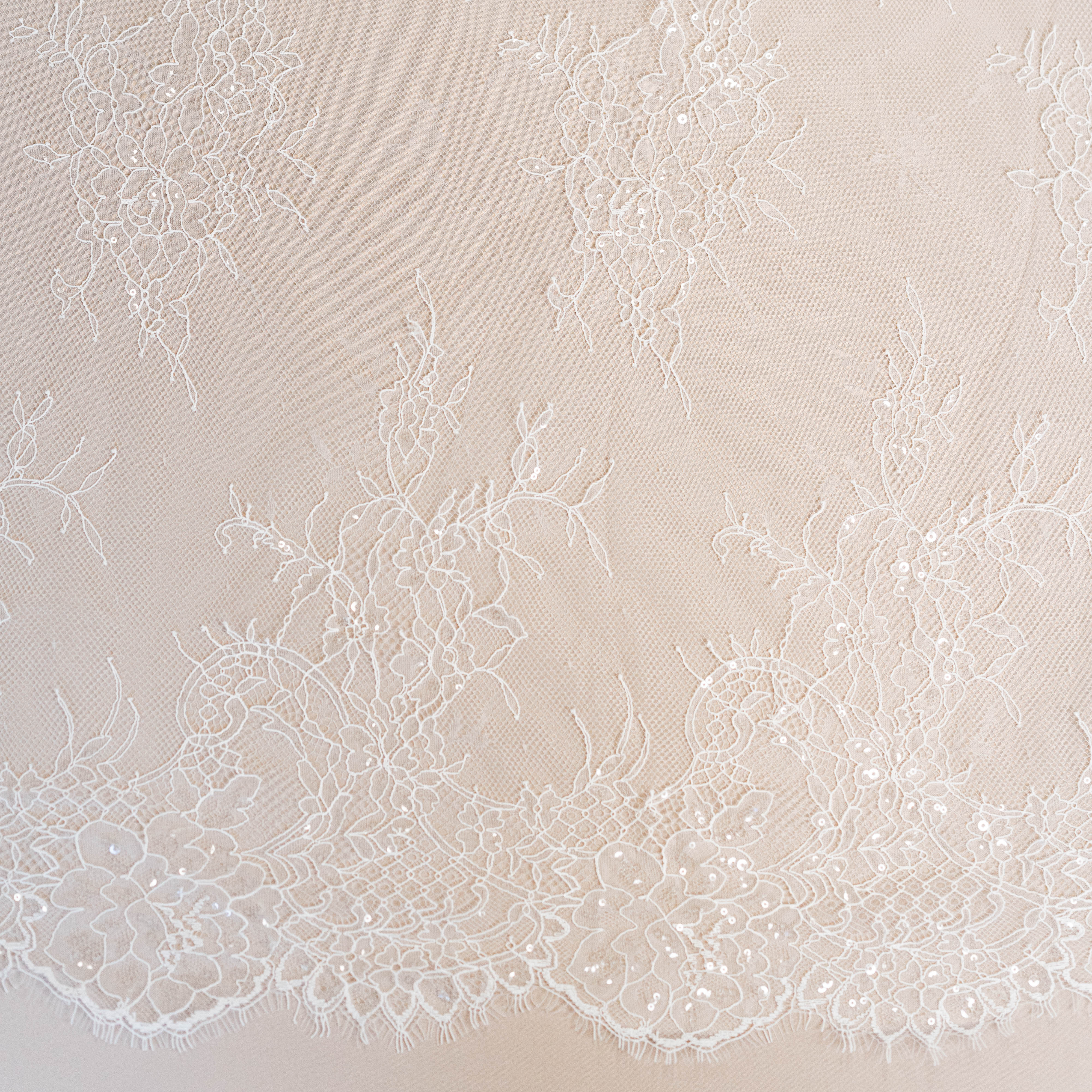 Ivory Beaded Lace — featuring scalloped edges, floral motifs and hand-beading, in nylon and viscose, 130cm wide