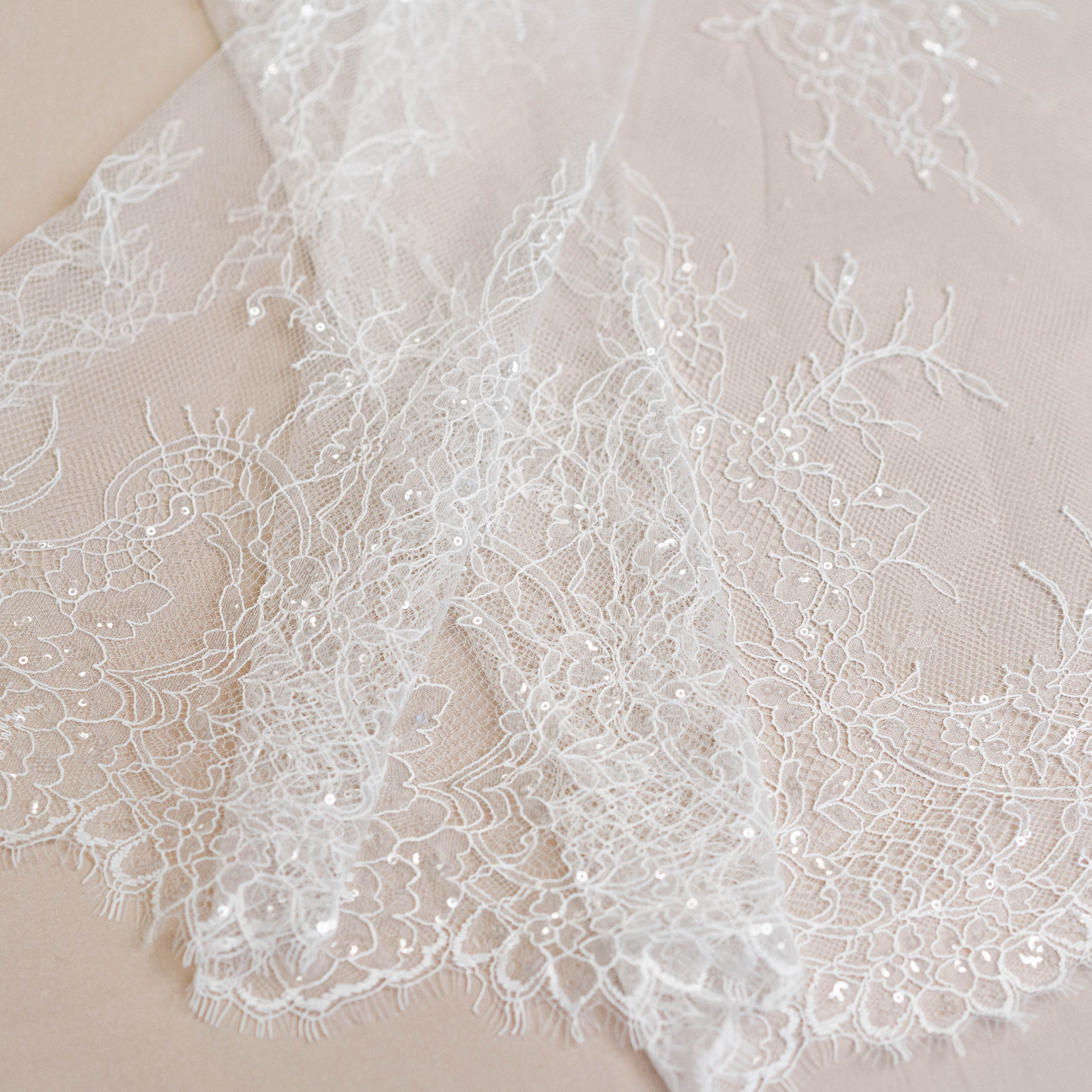 Ivory Beaded Lace — featuring scalloped edges, floral motifs and hand-beading, in nylon and viscose, 130cm wide