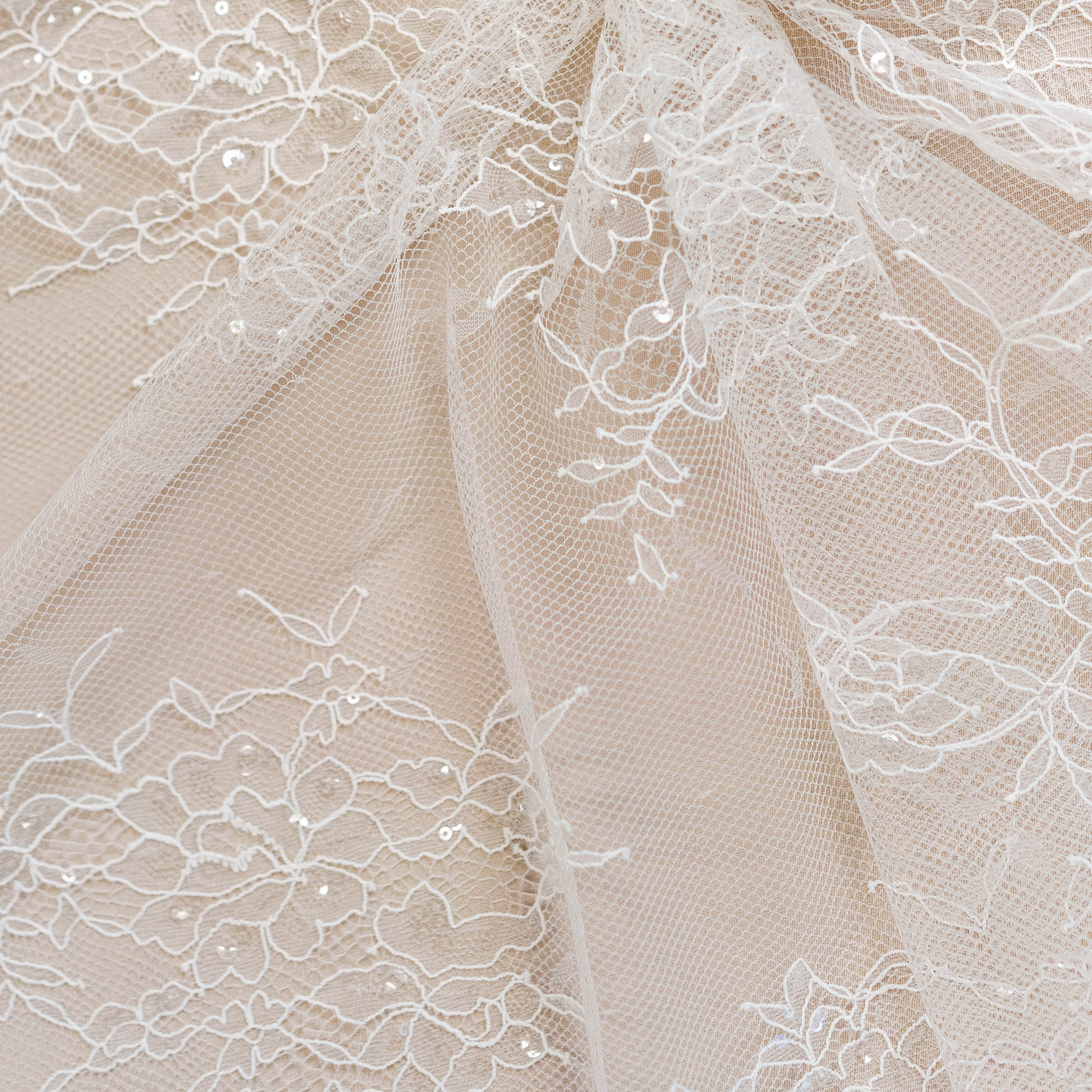 Ivory Beaded Lace — featuring scalloped edges, floral motifs and hand-beading, in nylon and viscose, 130cm wide