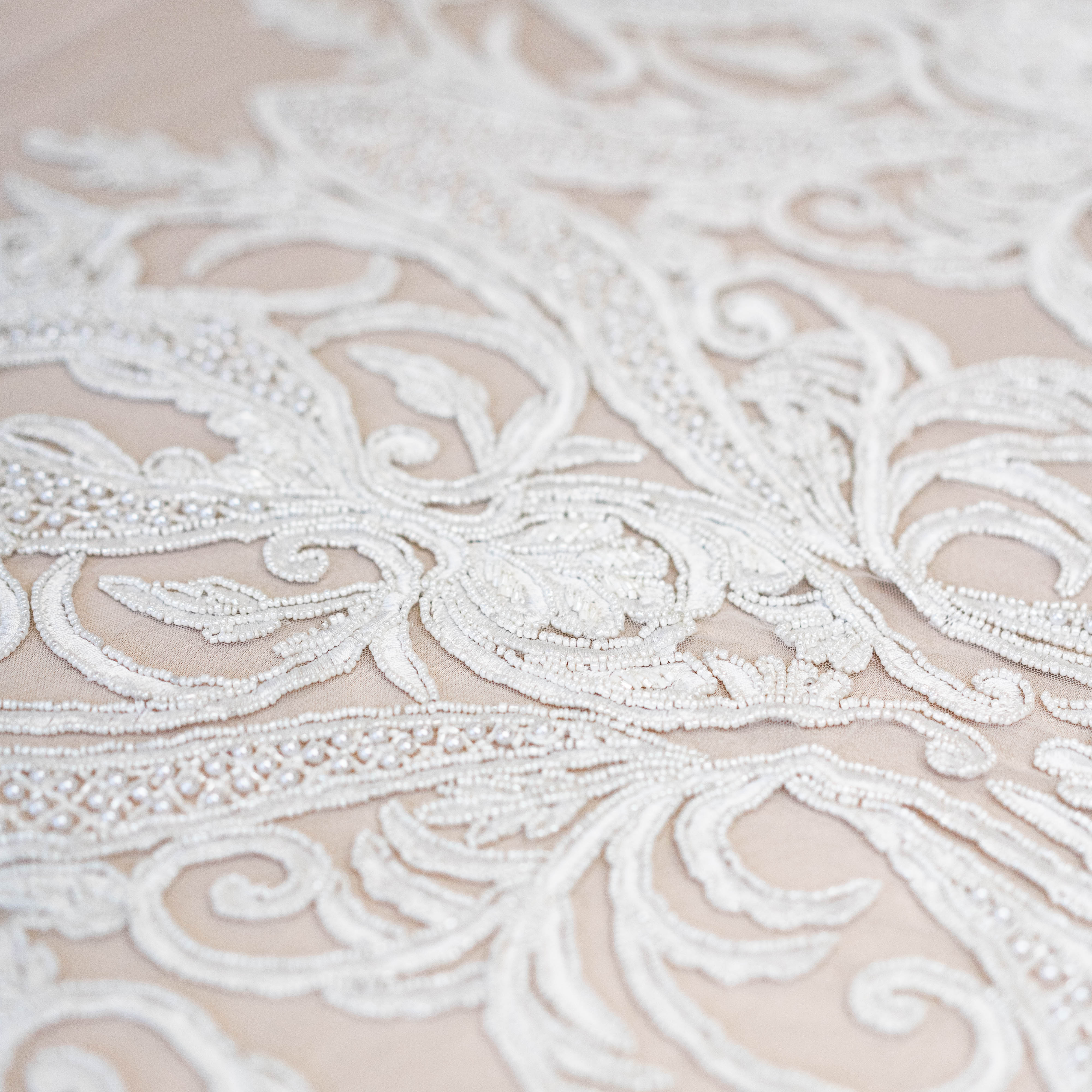 Ivory Beaded Tulle — featuring hand-beading, 100% nylon, 130cm wide
