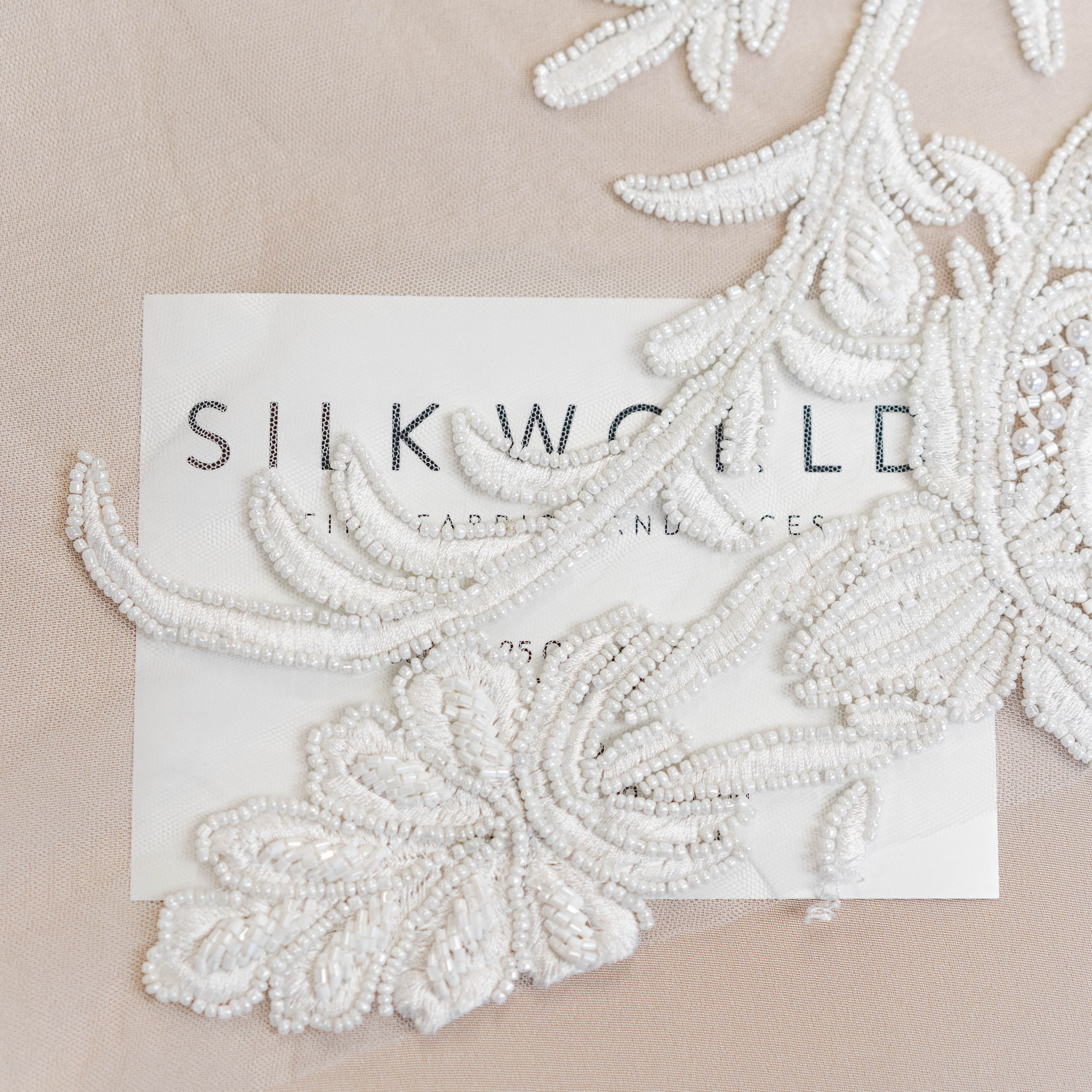 Ivory Beaded Tulle — featuring hand-beading, 100% nylon, 130cm wide