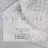 White Lattice Embroidered Tulle — featuring hand-beading and sequins, 50% nylon 50% rayon, 130cm wide