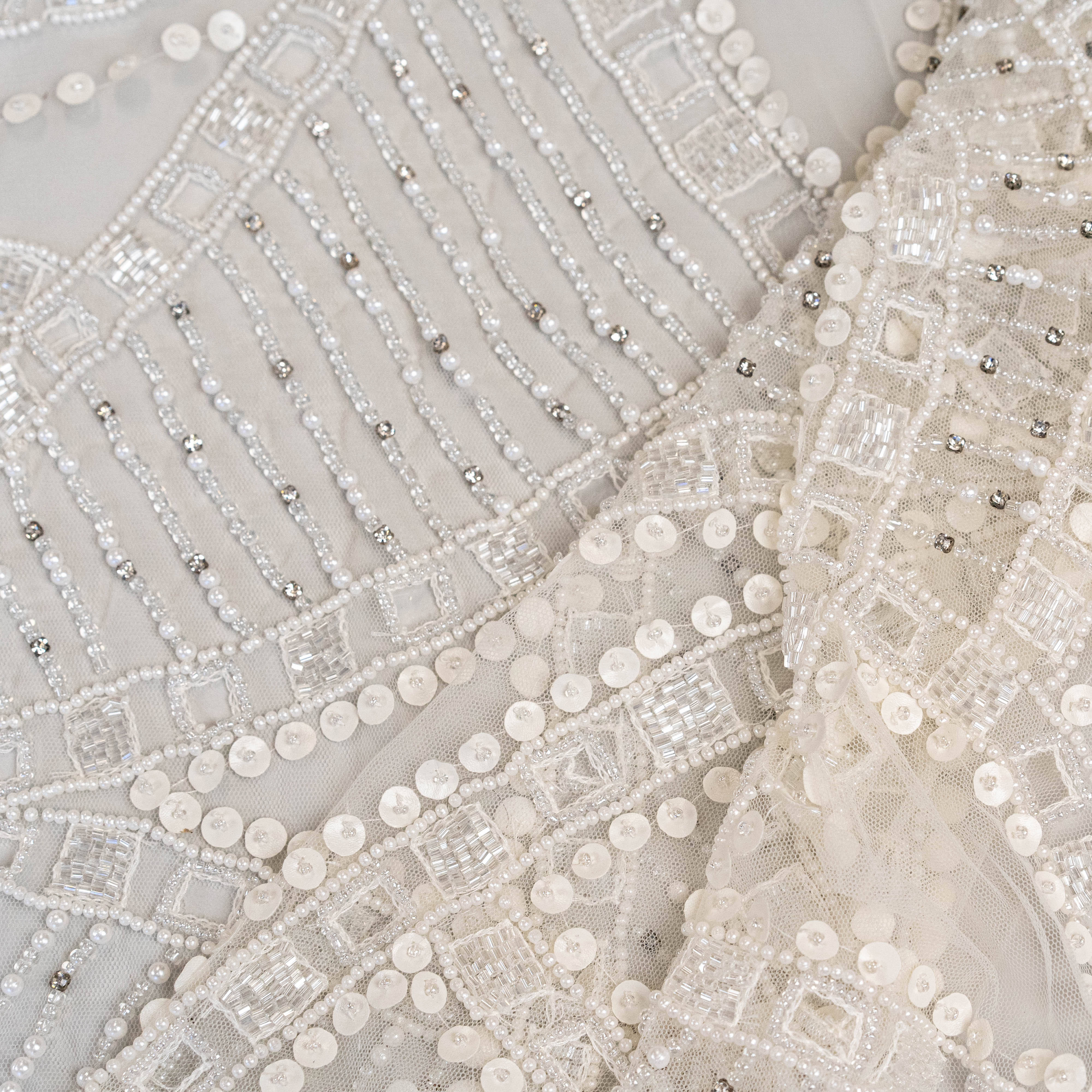 Ivory Cutwork Beaded Tulle — featuring hand-beading and sequins, 100% nylon, 140cm wide