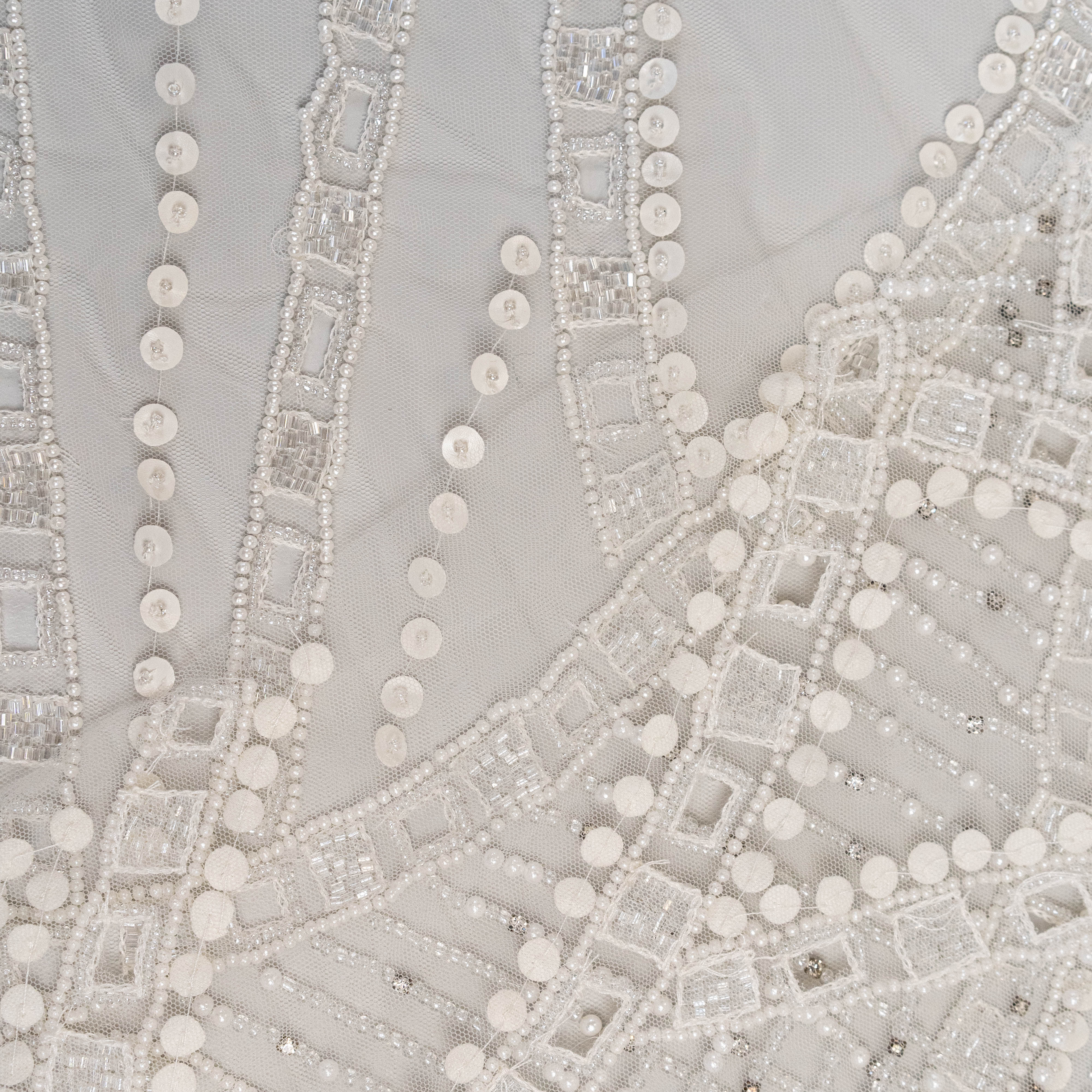 Ivory Cutwork Beaded Tulle — featuring hand-beading and sequins, 100% nylon, 140cm wide