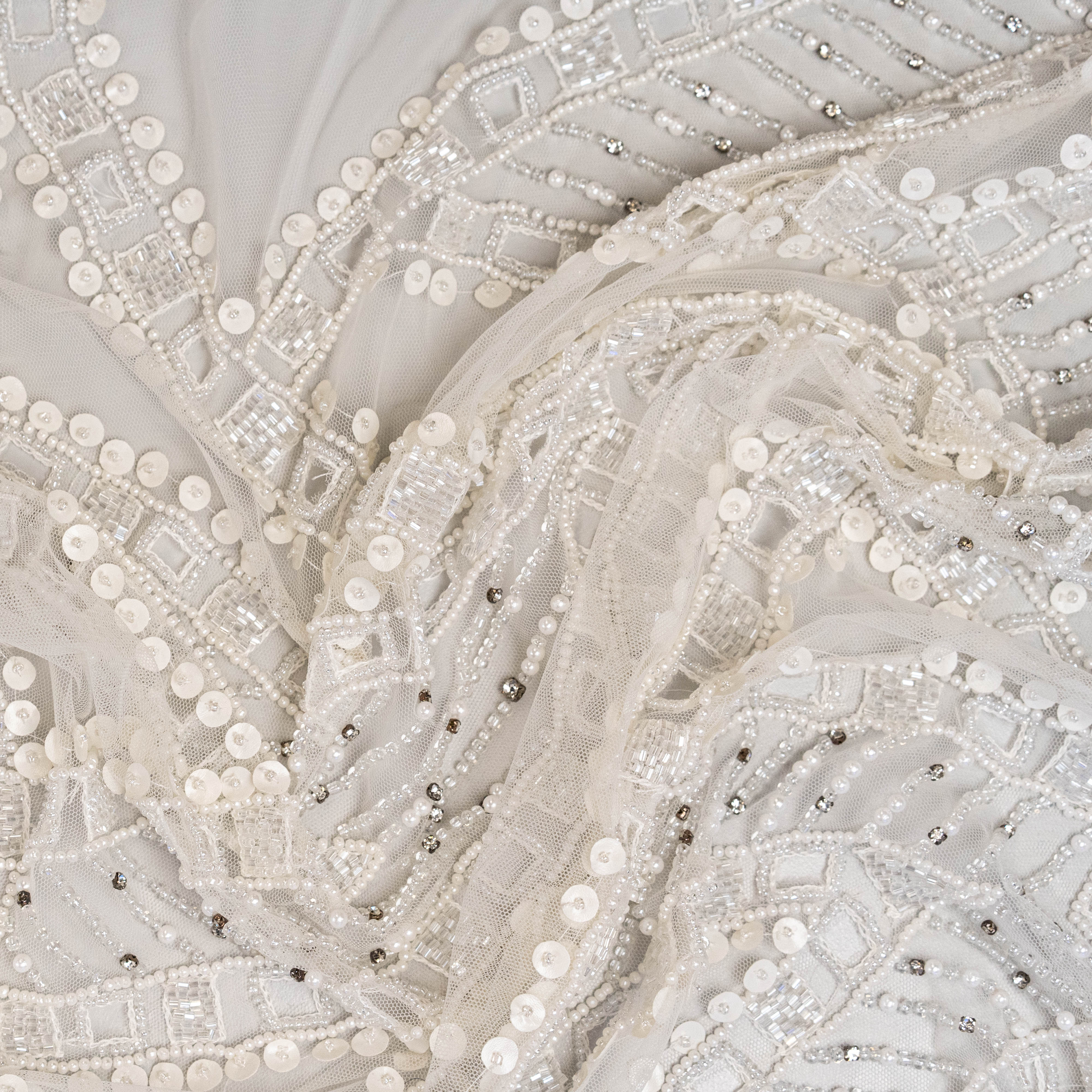 Ivory Cutwork Beaded Tulle — featuring hand-beading and sequins, 100% nylon, 140cm wide
