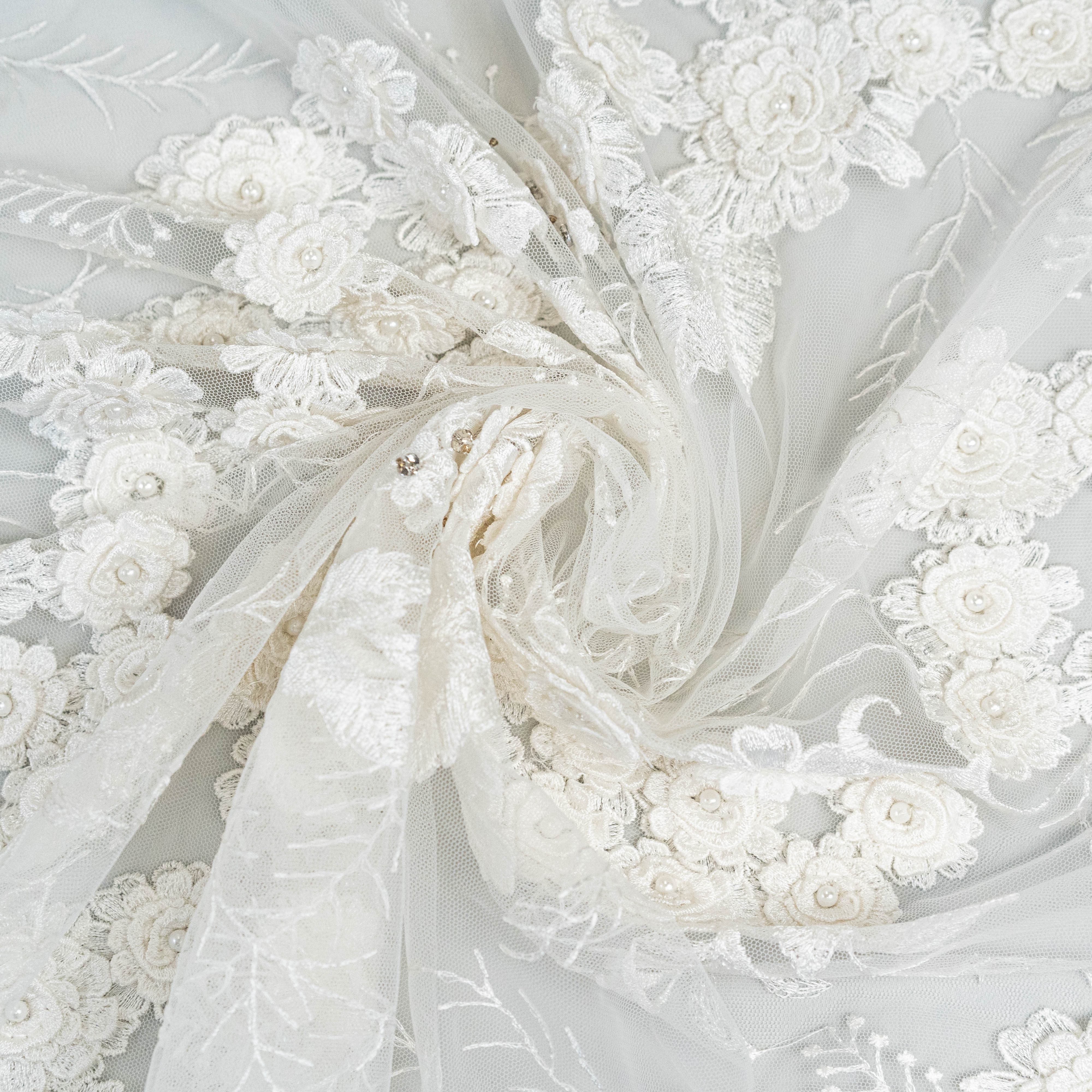 Ivory Embroidered 3D Tulle — featuring floral motifs, a 3D floral design and hand-beading, 50% nylon 50% rayon, 140cm wide