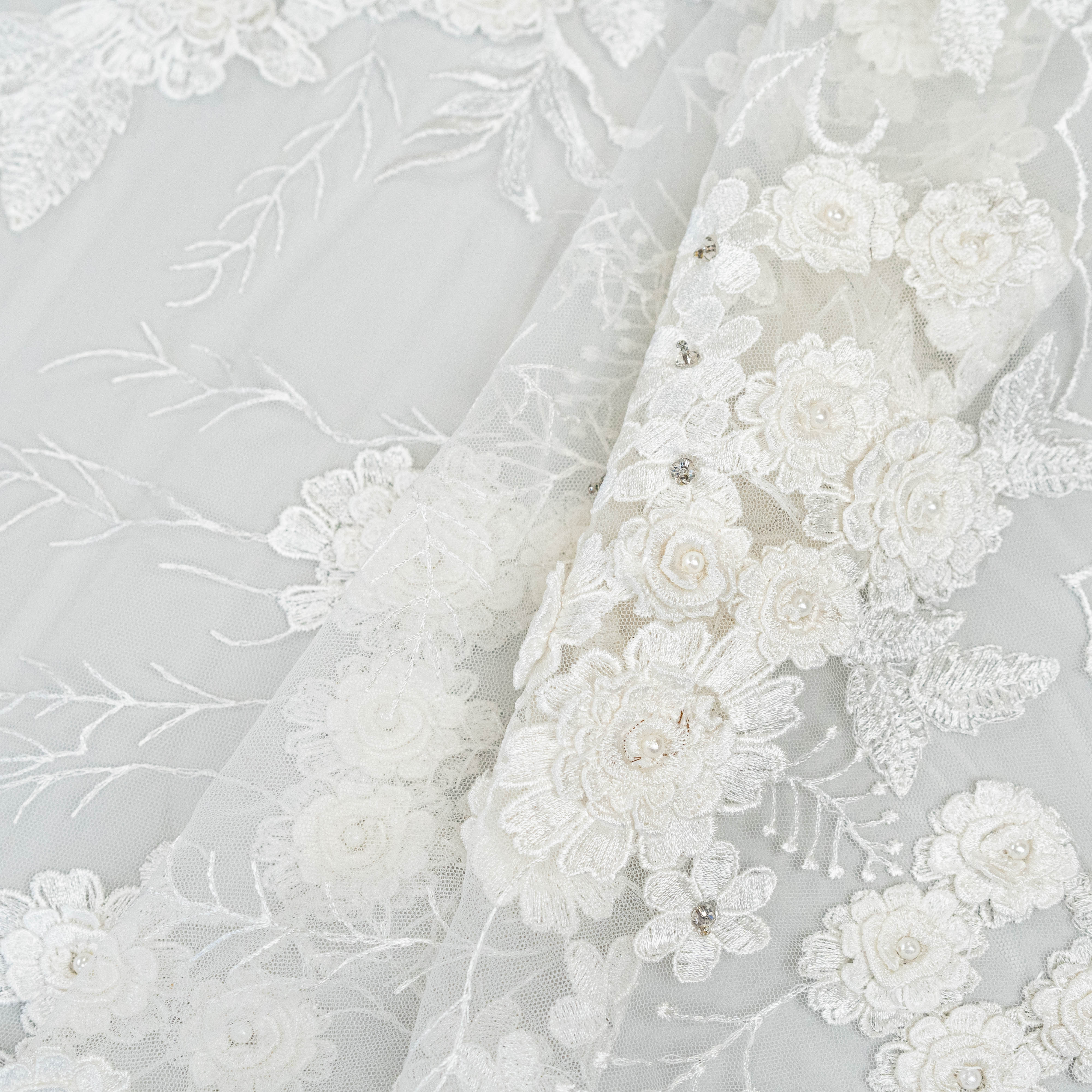 Ivory Embroidered 3D Tulle — featuring floral motifs, a 3D floral design and hand-beading, 50% nylon 50% rayon, 140cm wide