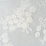 Ivory Embroidered 3D Tulle — featuring floral motifs, a 3D floral design and hand-beading, 50% nylon 50% rayon, 140cm wide