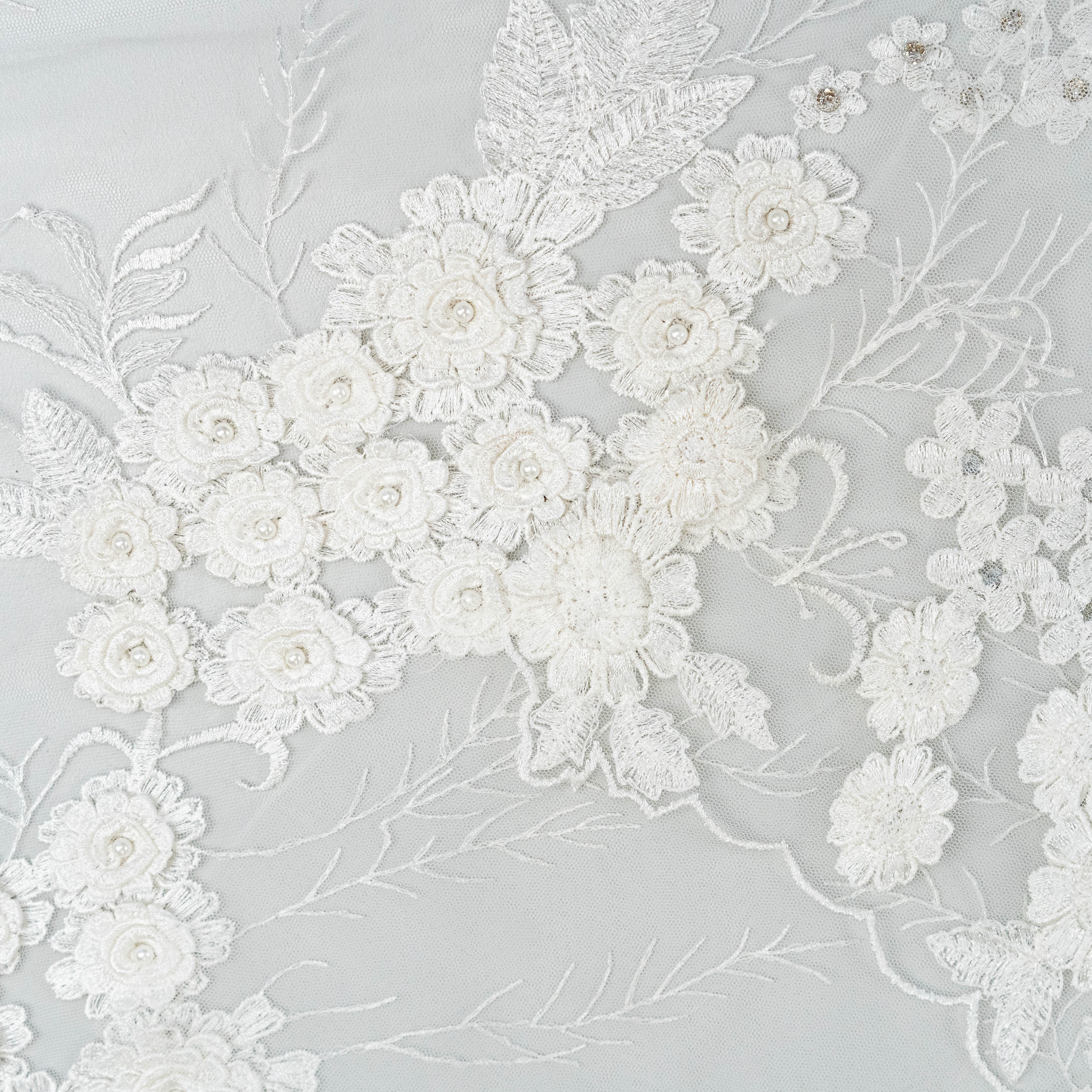Ivory Embroidered 3D Tulle — featuring floral motifs, a 3D floral design and hand-beading, 50% nylon 50% rayon, 140cm wide
