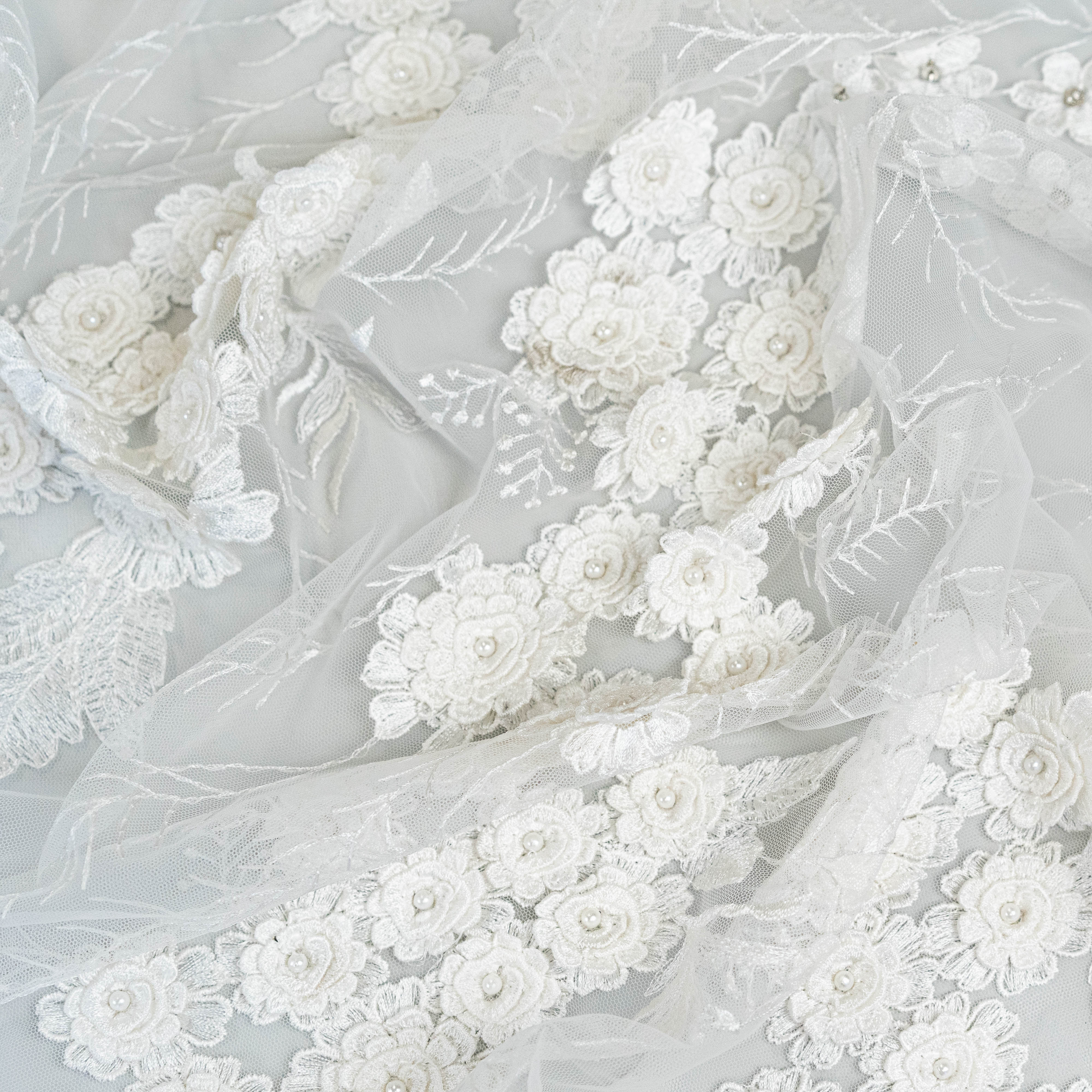 Ivory Embroidered 3D Tulle — featuring floral motifs, a 3D floral design and hand-beading, 50% nylon 50% rayon, 140cm wide
