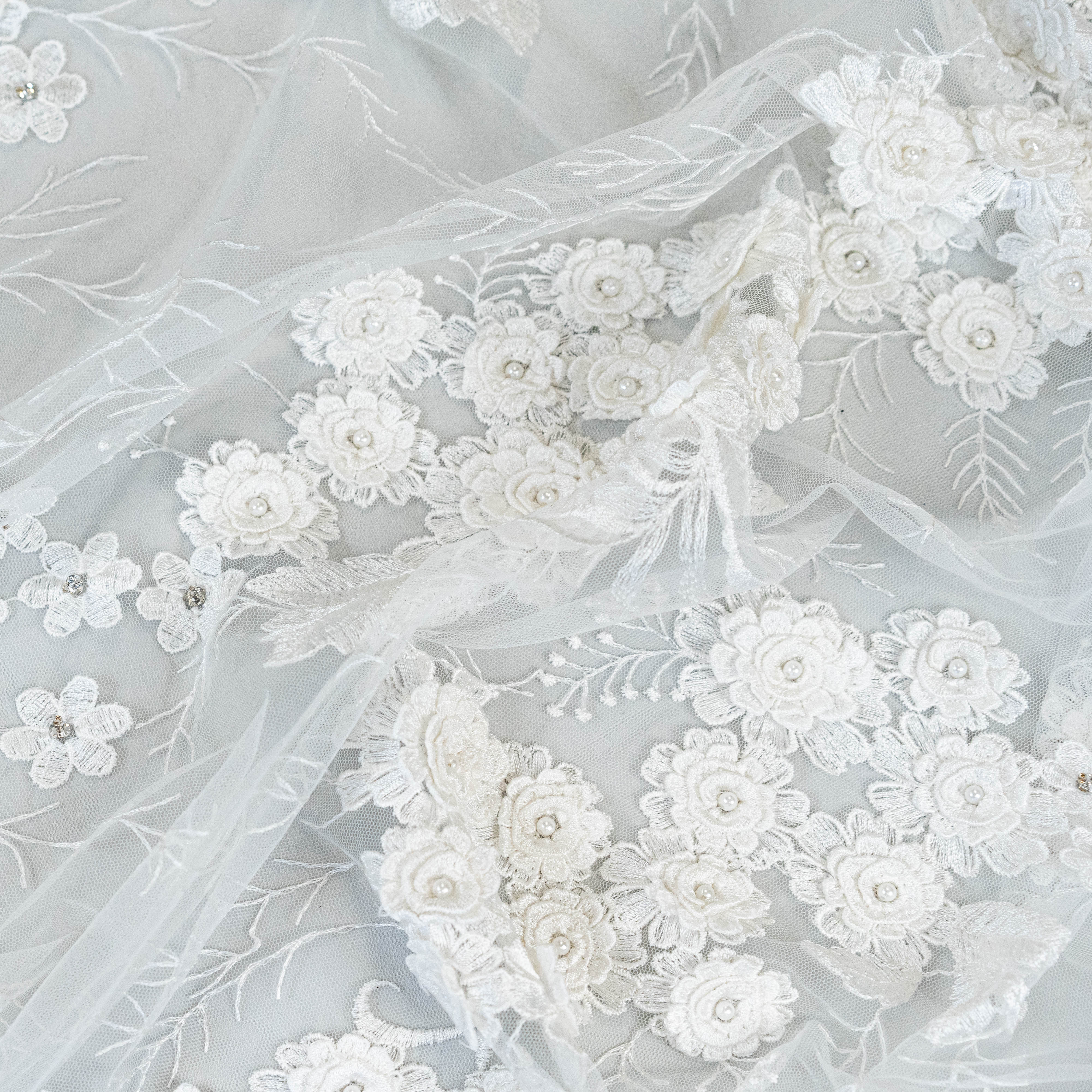 Ivory Embroidered 3D Tulle — featuring floral motifs, a 3D floral design and hand-beading, 50% nylon 50% rayon, 140cm wide